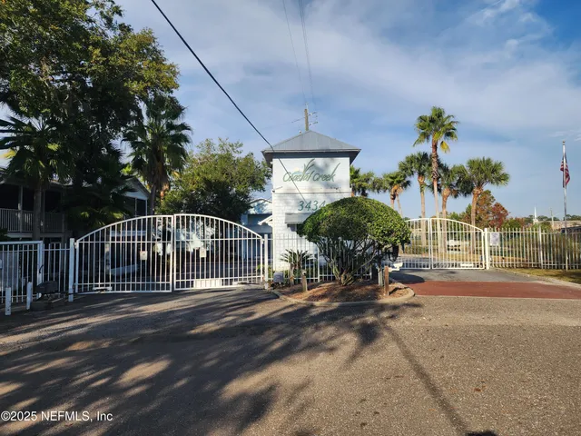 a view of a house with backyard and porch
