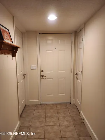 a view of hallway with a shower
