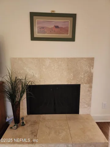 a black and white wall with a potted plant