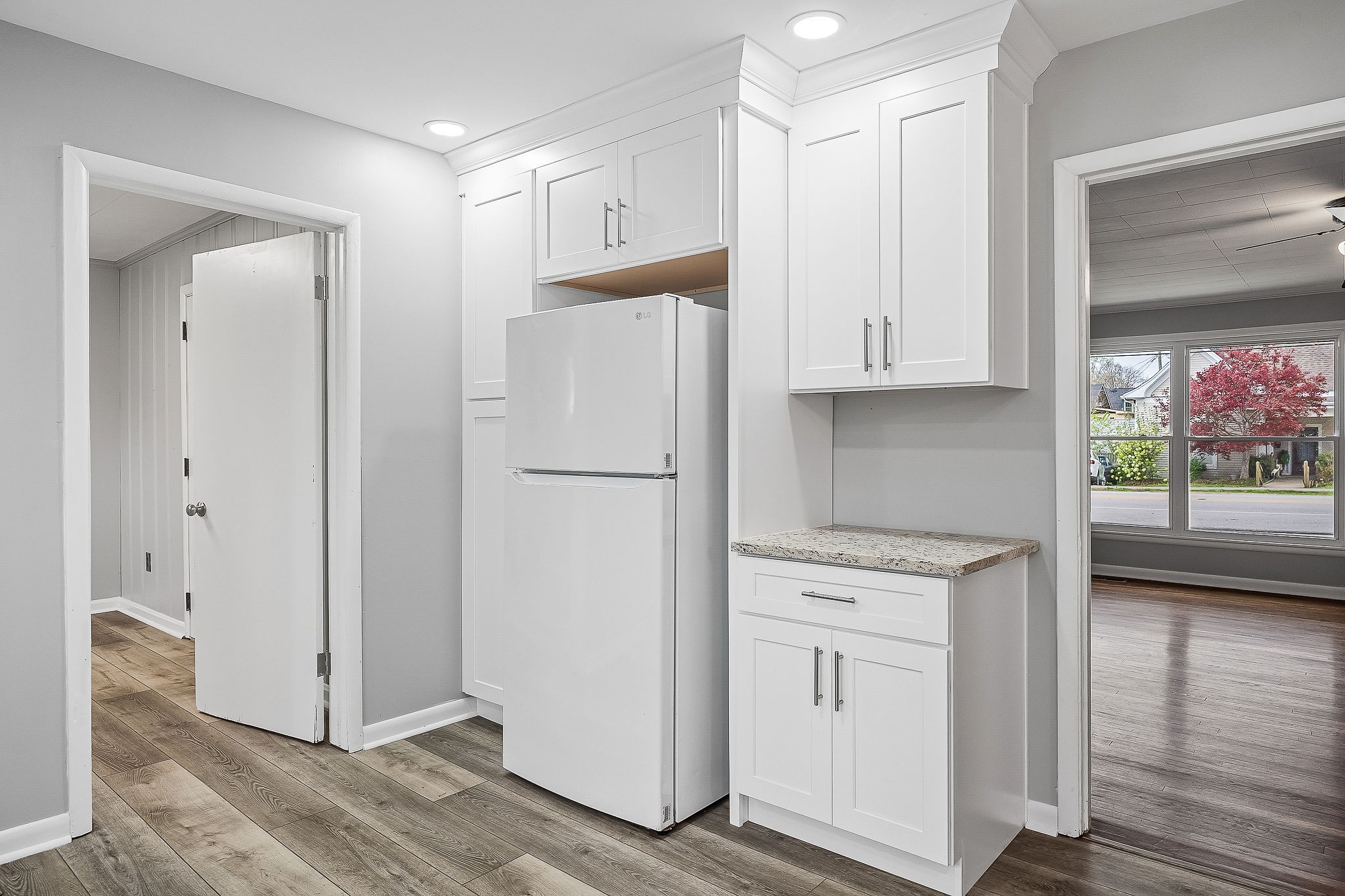 106 North Main Street Sparta, TN 38583 - Photo 11 of 28 a kitchen with white cabinets and white appliances