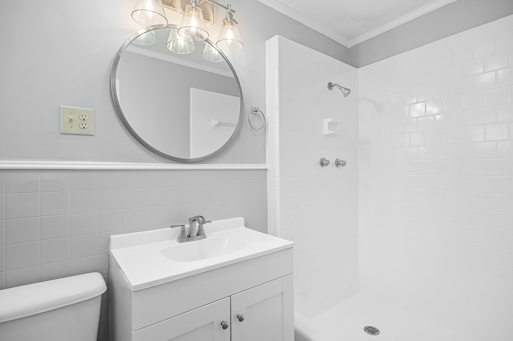 106 North Main Street Sparta, TN 38583 - Photo 16 of 28 a bathroom with a sink a toilet and a mirror
