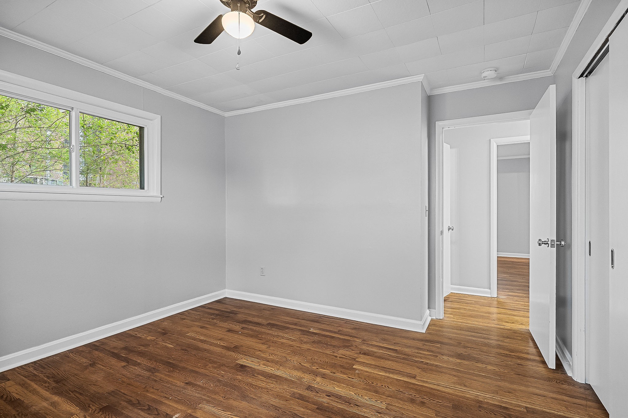 106 North Main Street Sparta, TN 38583 - Photo 18 of 28 wooden floor in an empty room with a window