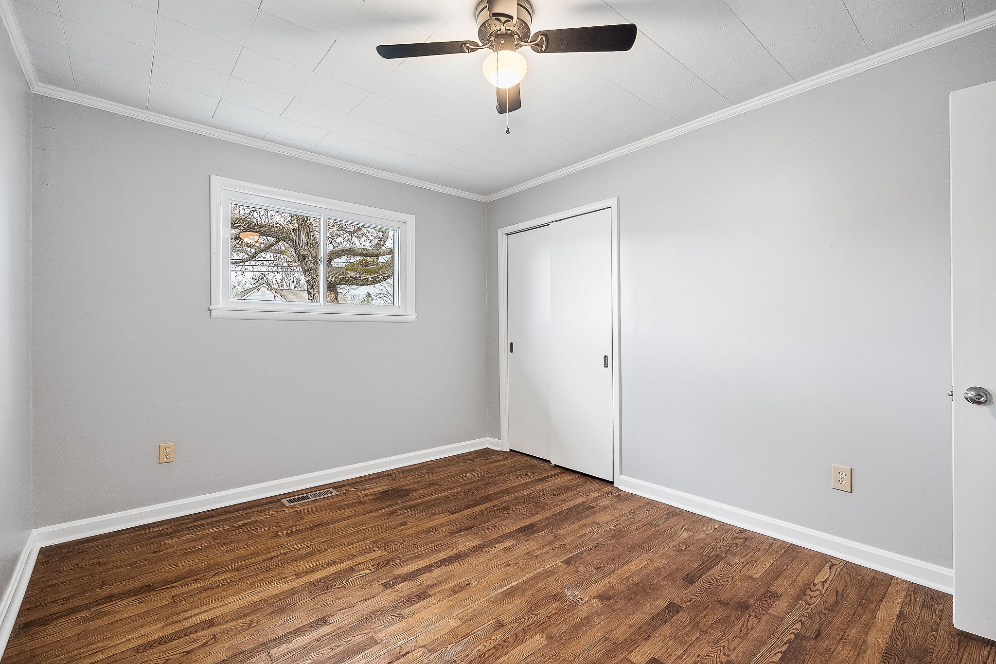 106 North Main Street Sparta, TN 38583 - Photo 23 of 28 an empty room with wooden floor and ceiling fan