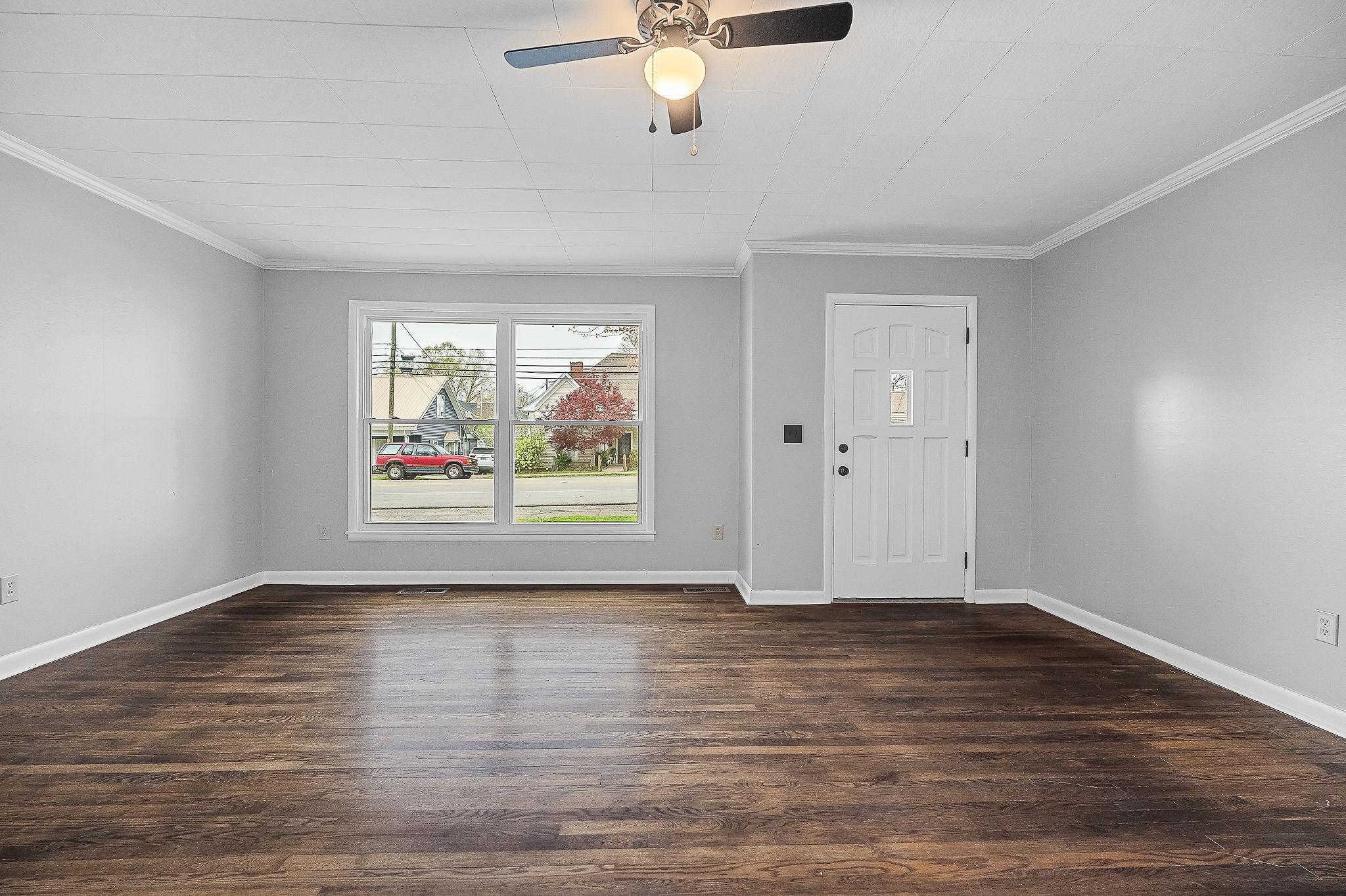 106 North Main Street Sparta, TN 38583 - Photo 6 of 28 a view of an empty room with a window and wooden floor