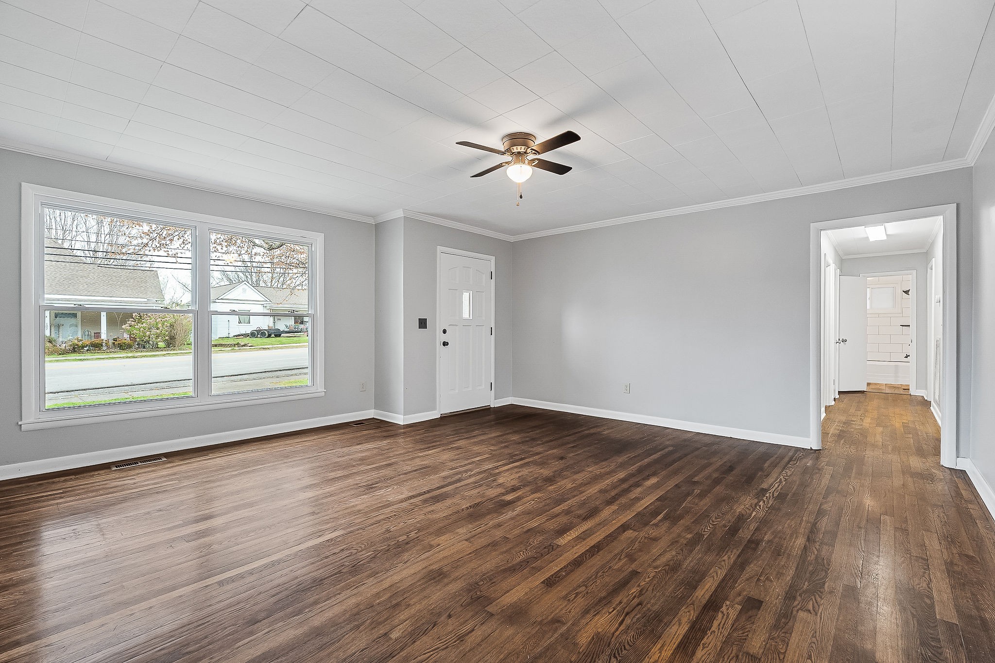 106 North Main Street Sparta, TN 38583 - Photo 7 of 28 a view of empty room with wooden floor and fan