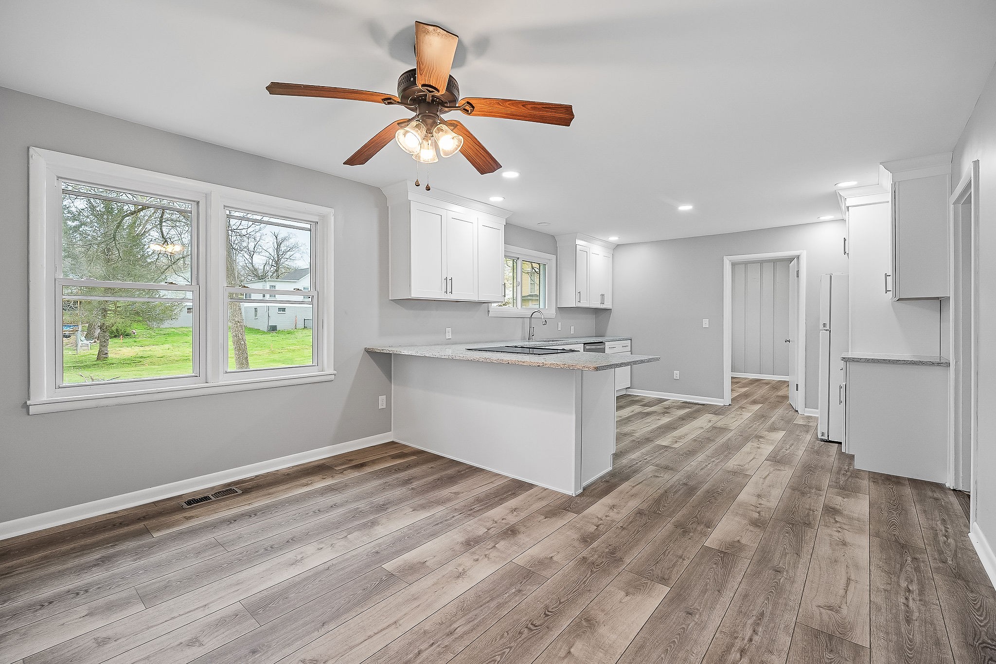106 North Main Street Sparta, TN 38583 - Photo 9 of 28 a view of kitchen with wooden floor and window