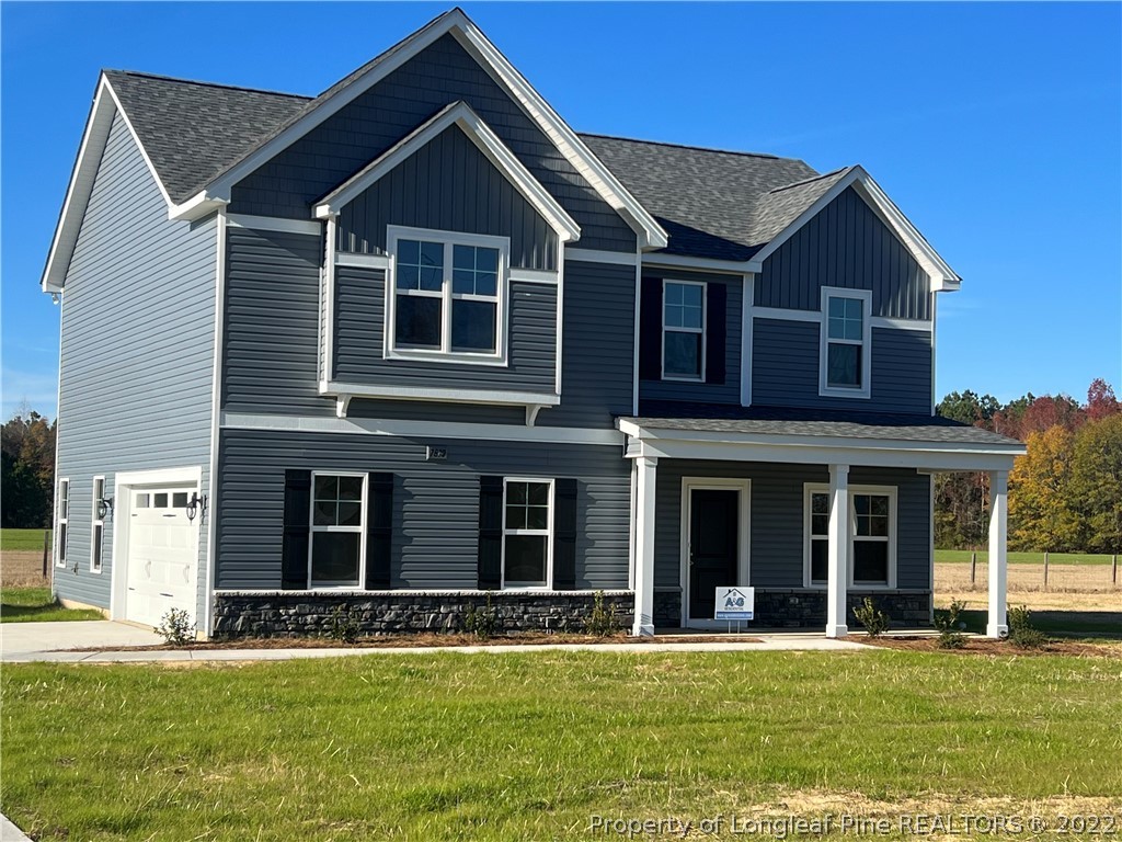7810 Rufus Johnson Road St. Pauls, NC 28384 - Photo 1 of 18 a front view of a house with a yard