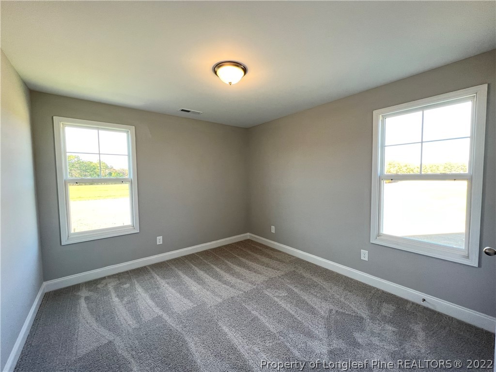 7810 Rufus Johnson Road St. Pauls, NC 28384 - Photo 10 of 18 an empty room with a window