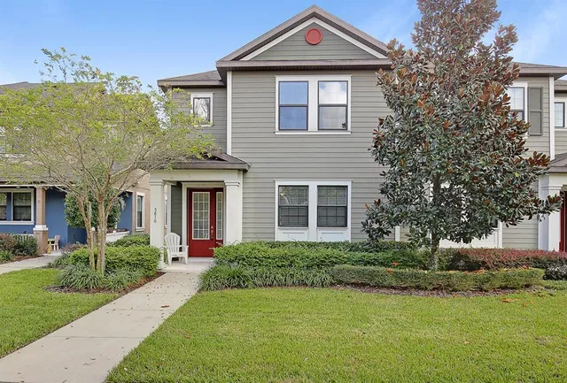 a front view of a house with a yard