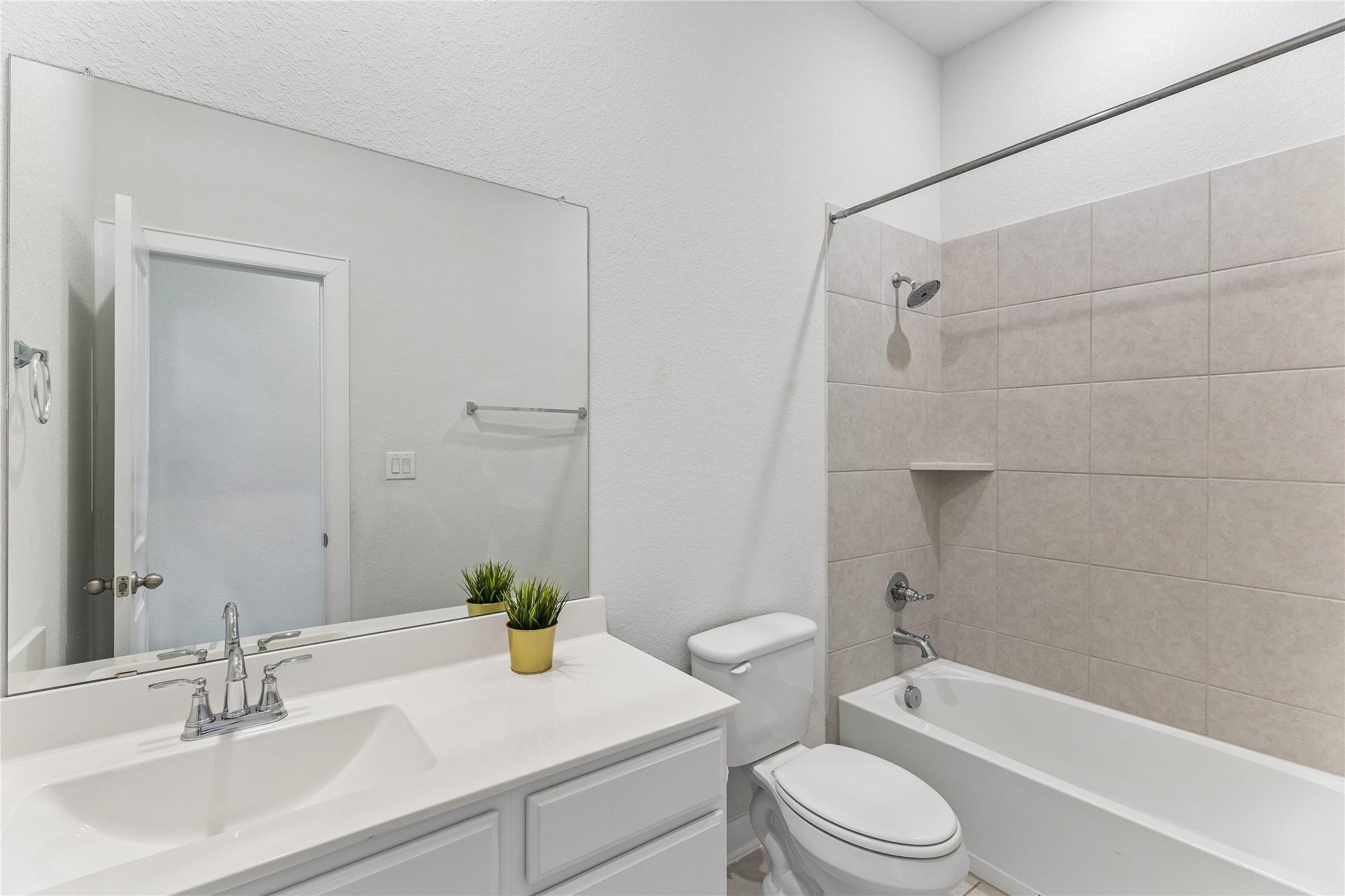 298 Wild Pecan Loop Buda, TX 78610 - Photo 32 of 40 a bathroom with a sink a toilet and shower
