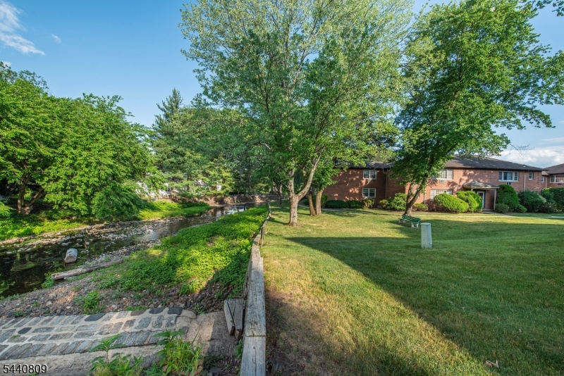 206 Main Street, Unit 42A Millburn, NJ 07041 - Photo 19 of 21 a view of a house with a yard