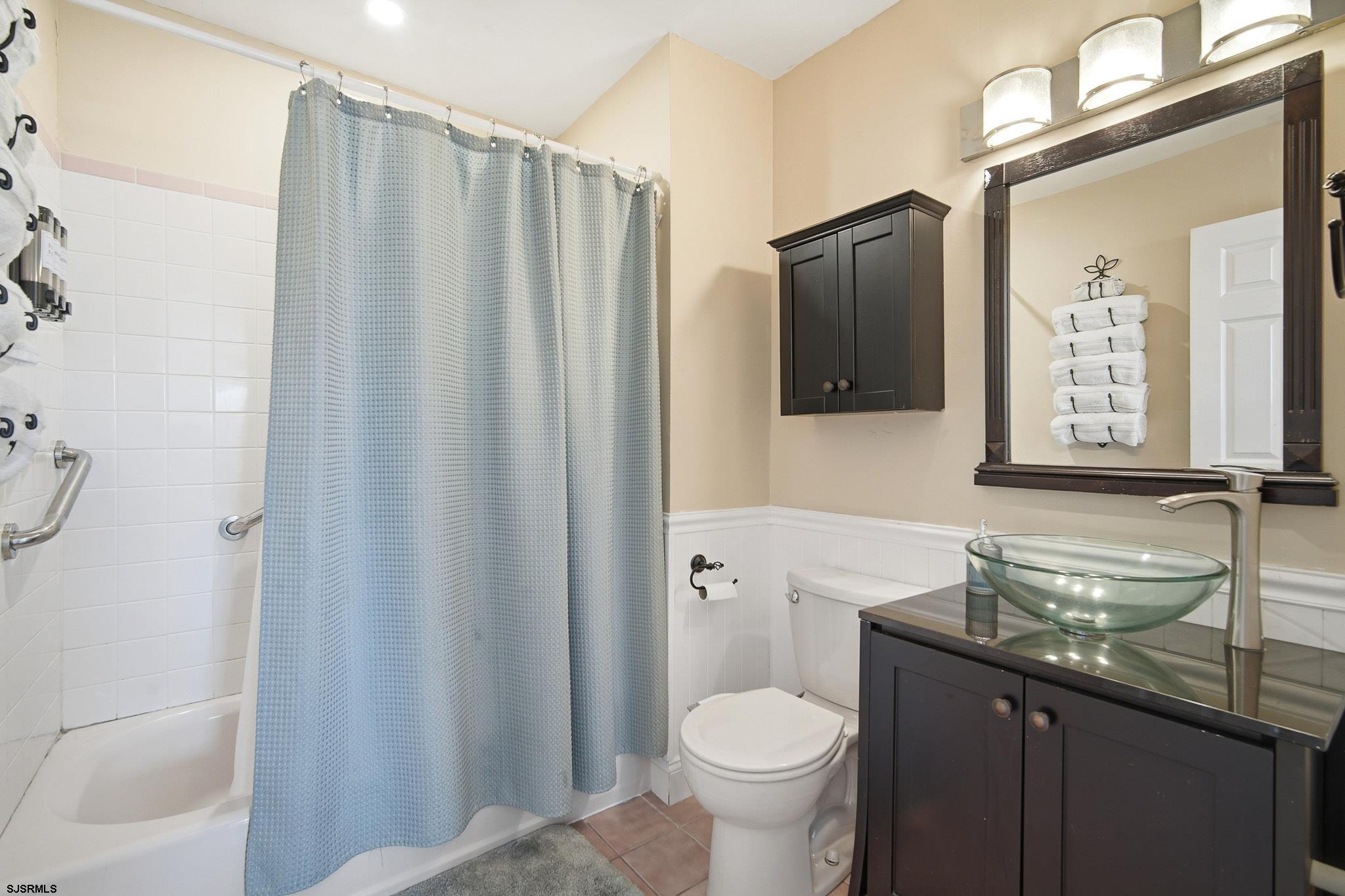 214 Hagen Road Brigantine, NJ 08203 - Photo 23 of 34 a bathroom with a granite countertop sink toilet and shower