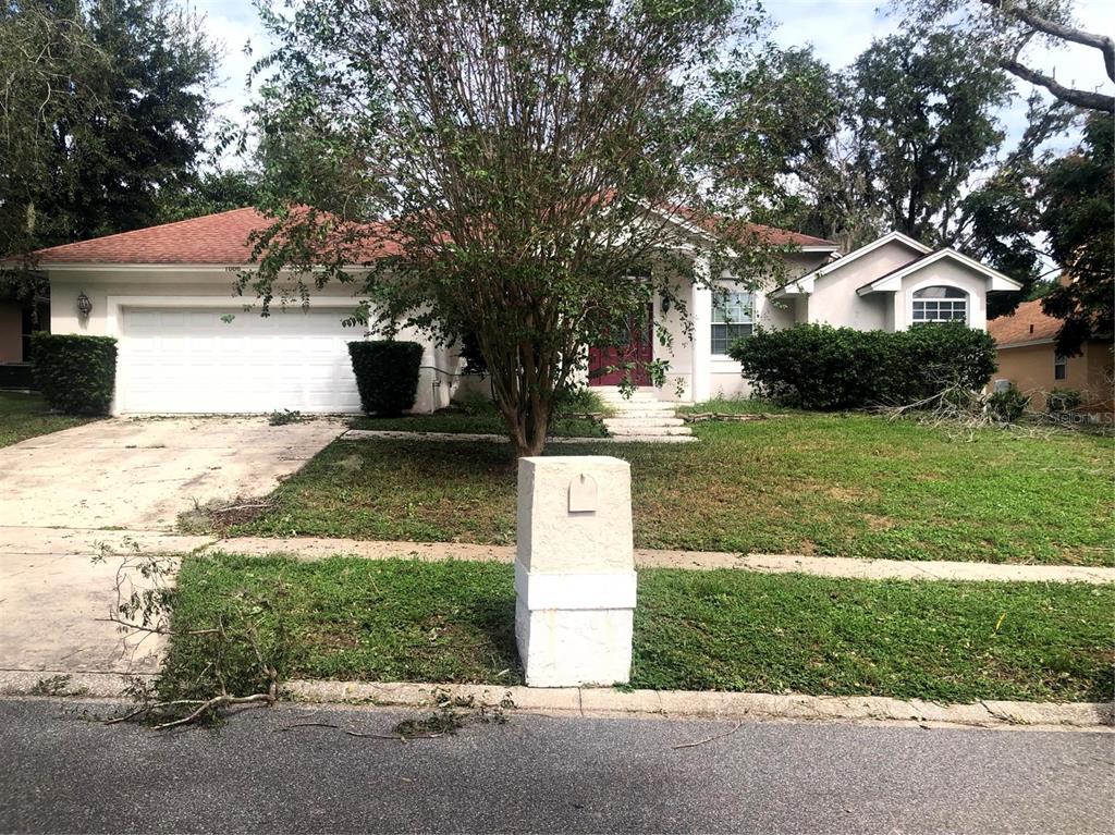 1006 Shady Maple Circle Ocoee, FL 34761 - Photo 1 of 1 a front view of a house with a yard and garage
