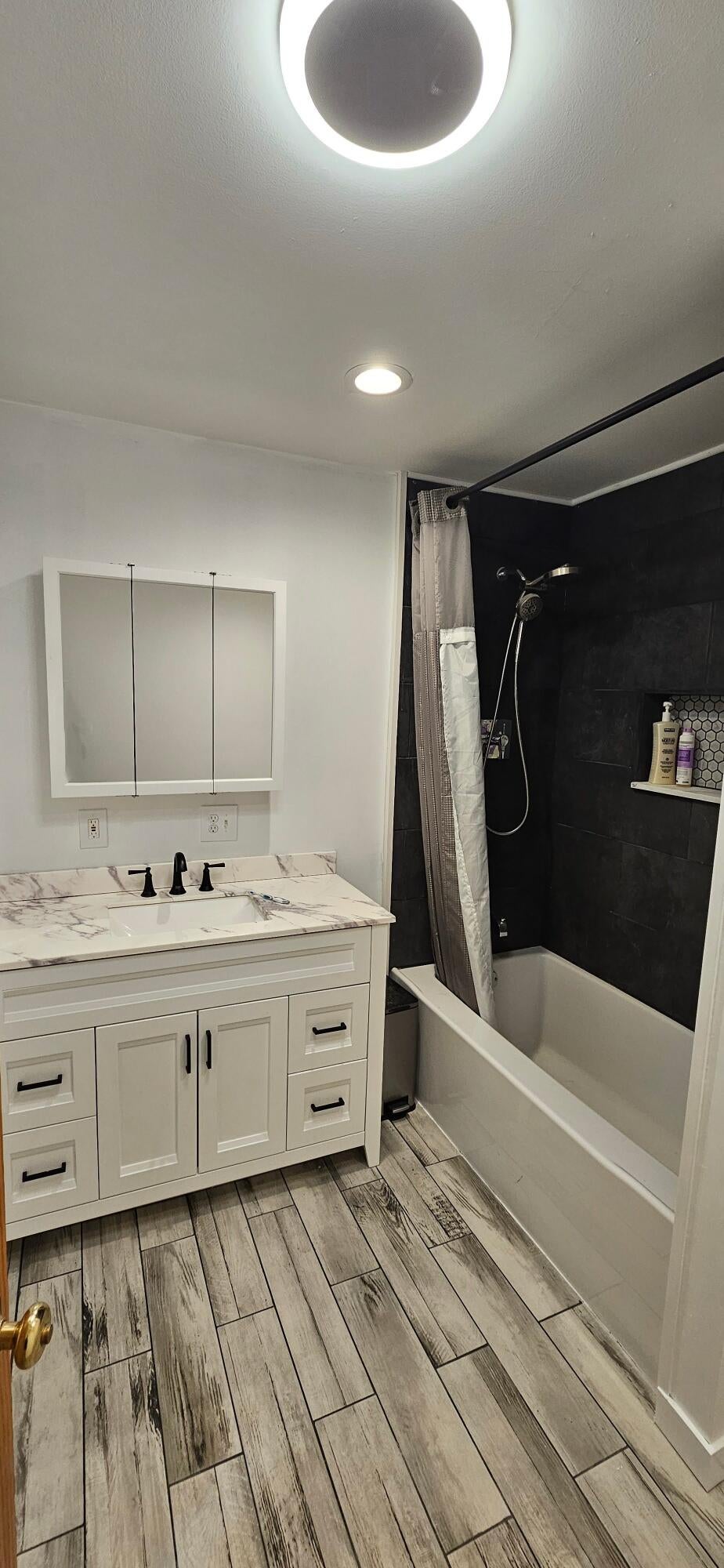2460 West Hamilton Road Alpena, MI 49707 - Photo 21 of 36 Private bathroom in bedroom #1 with tile floor and bath surround