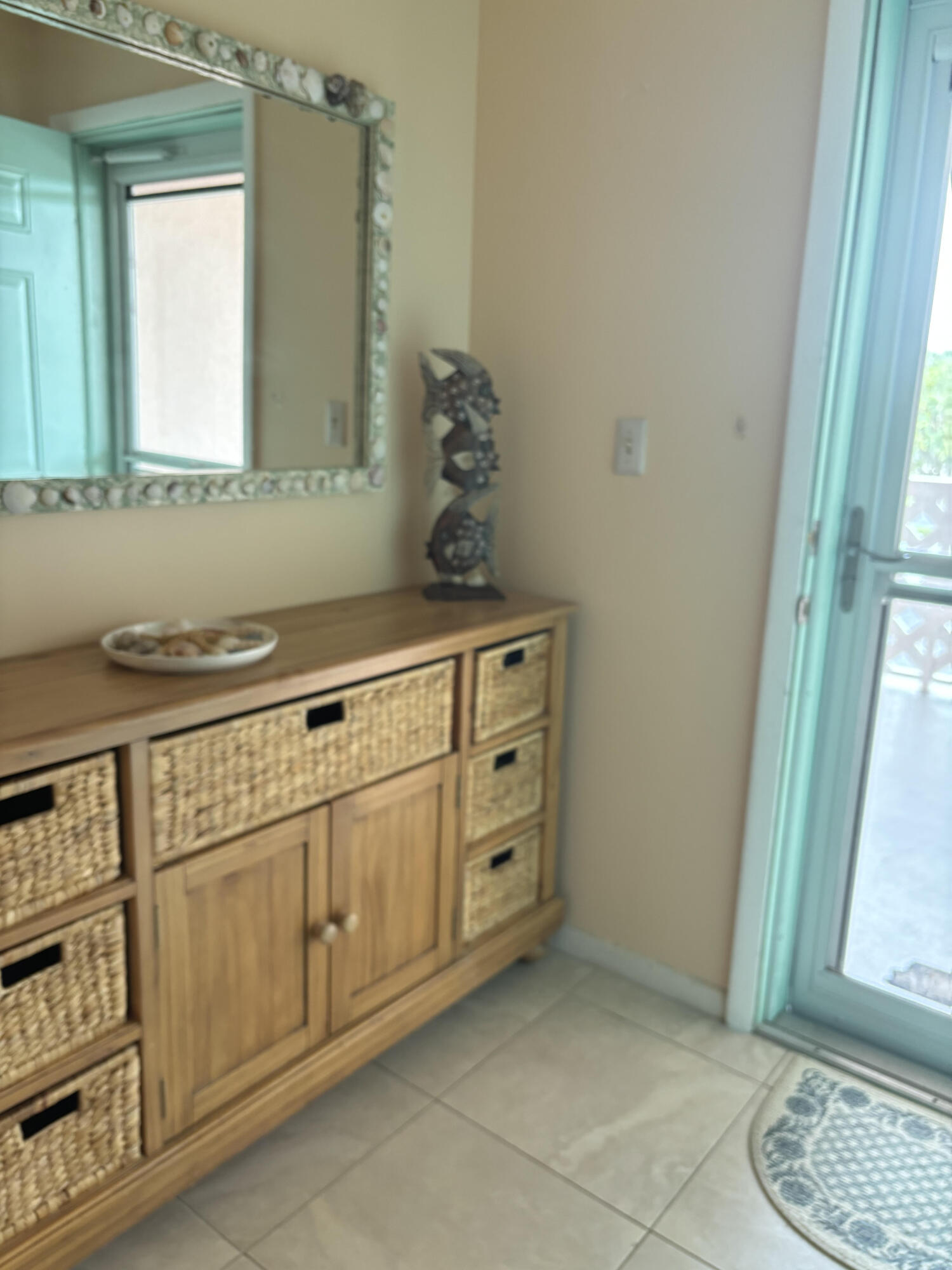 353 Highway 1, Unit A203 Jupiter, FL 33477 - Photo 21 of 26 a bathroom with a sink and a mirror
