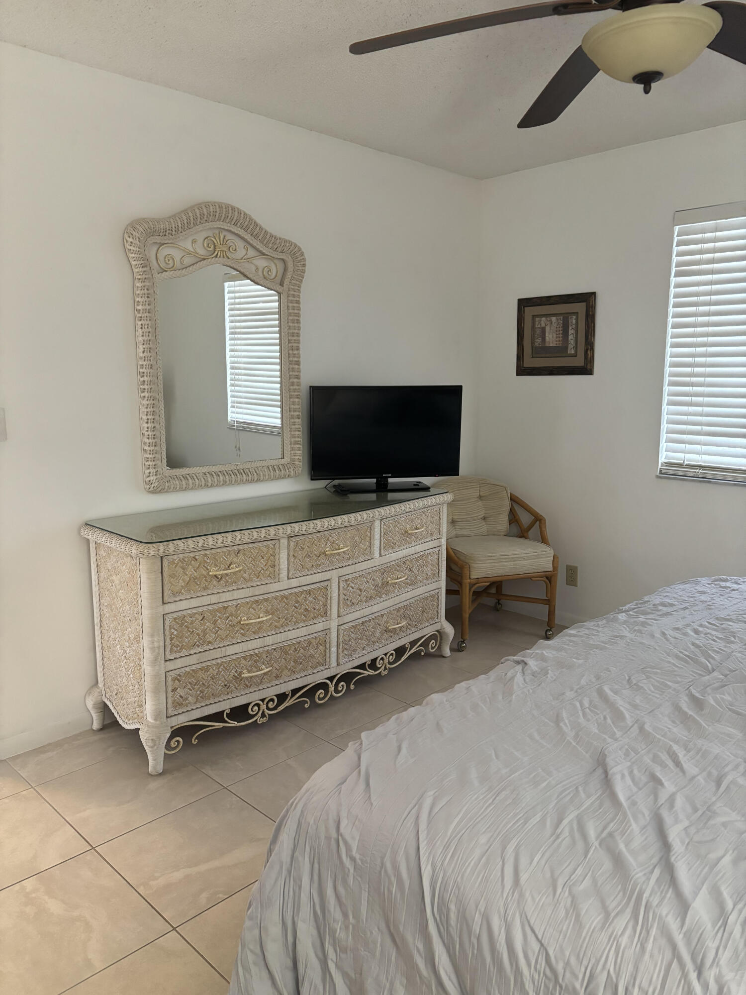 353 Highway 1, Unit A203 Jupiter, FL 33477 - Photo 22 of 26 a bedroom with a bed and a flat screen tv