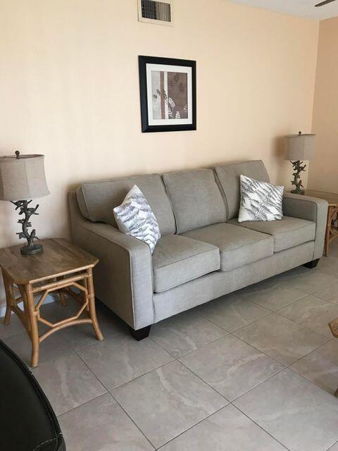 353 Highway 1, Unit A203 Jupiter, FL 33477 - Photo 8 of 26 a living room with furniture and a lamp