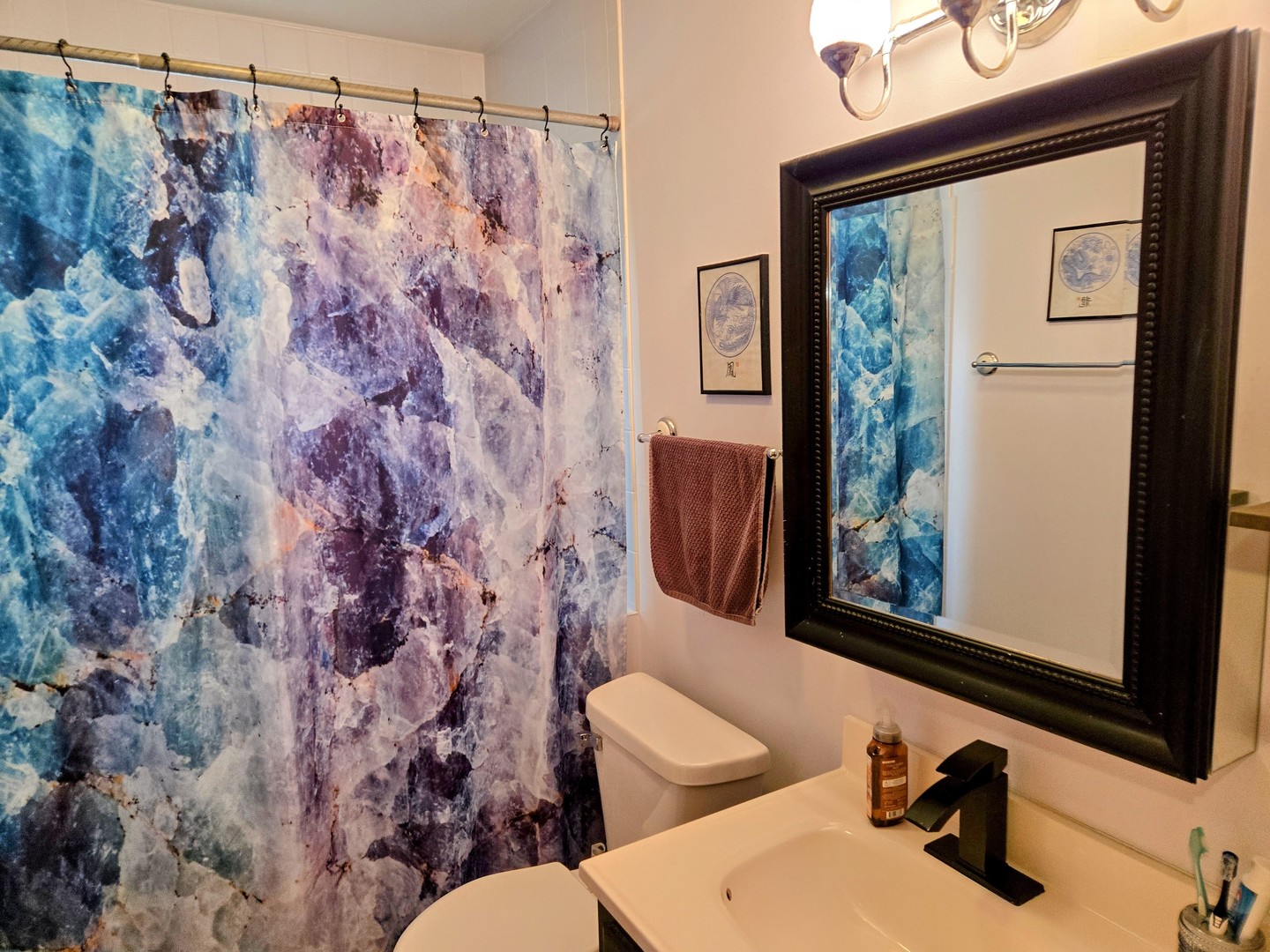 32 North Walnut Street Manteno, IL 60950 - Photo 6 of 11 a bathroom with a sink a toilet and a mirror