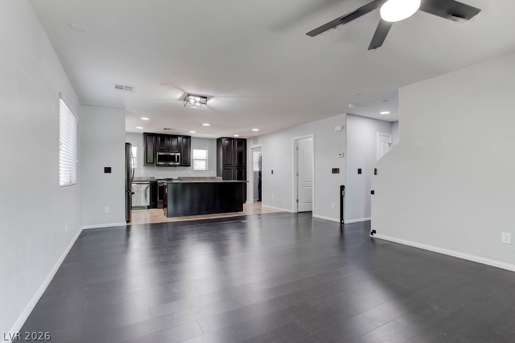 7724 Vibrant Thread Court Las Vegas, NV 89149 - Photo 17 of 43 An open-concept layout unites the kitchen and living spaces, creating an ideal area for entertaining.