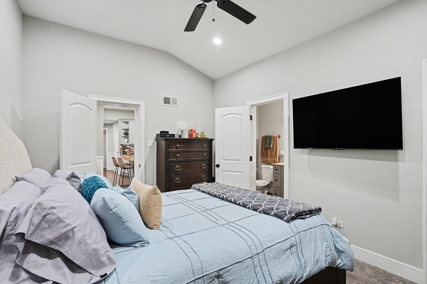 8953 South Aberdeen Street Chicago, IL 60620 - Photo 12 of 25 a bedroom with a bed and a flat screen tv