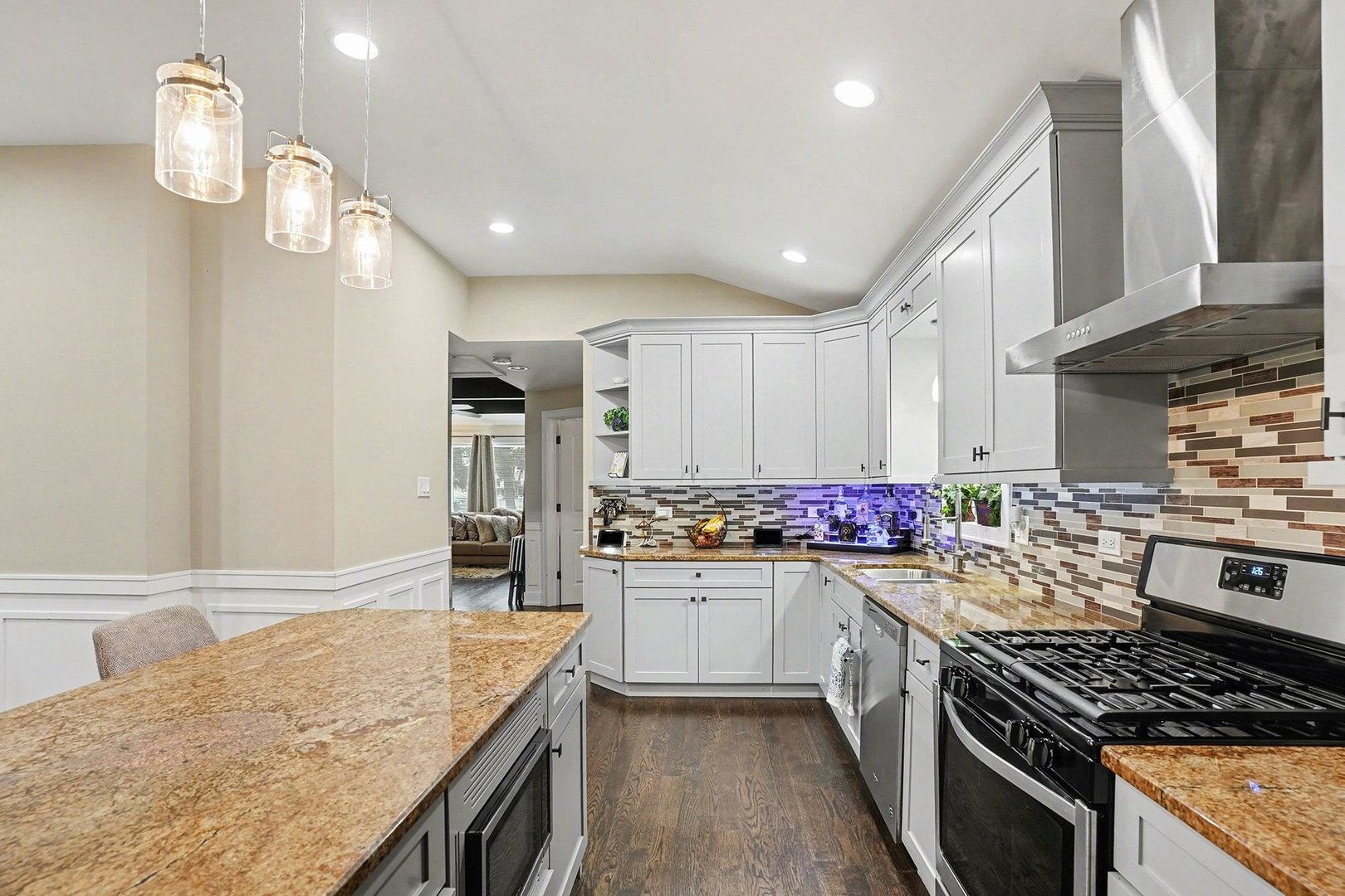 8953 South Aberdeen Street Chicago, IL 60620 - Photo 5 of 25 a kitchen with stainless steel appliances granite countertop a sink stove and refrigerator