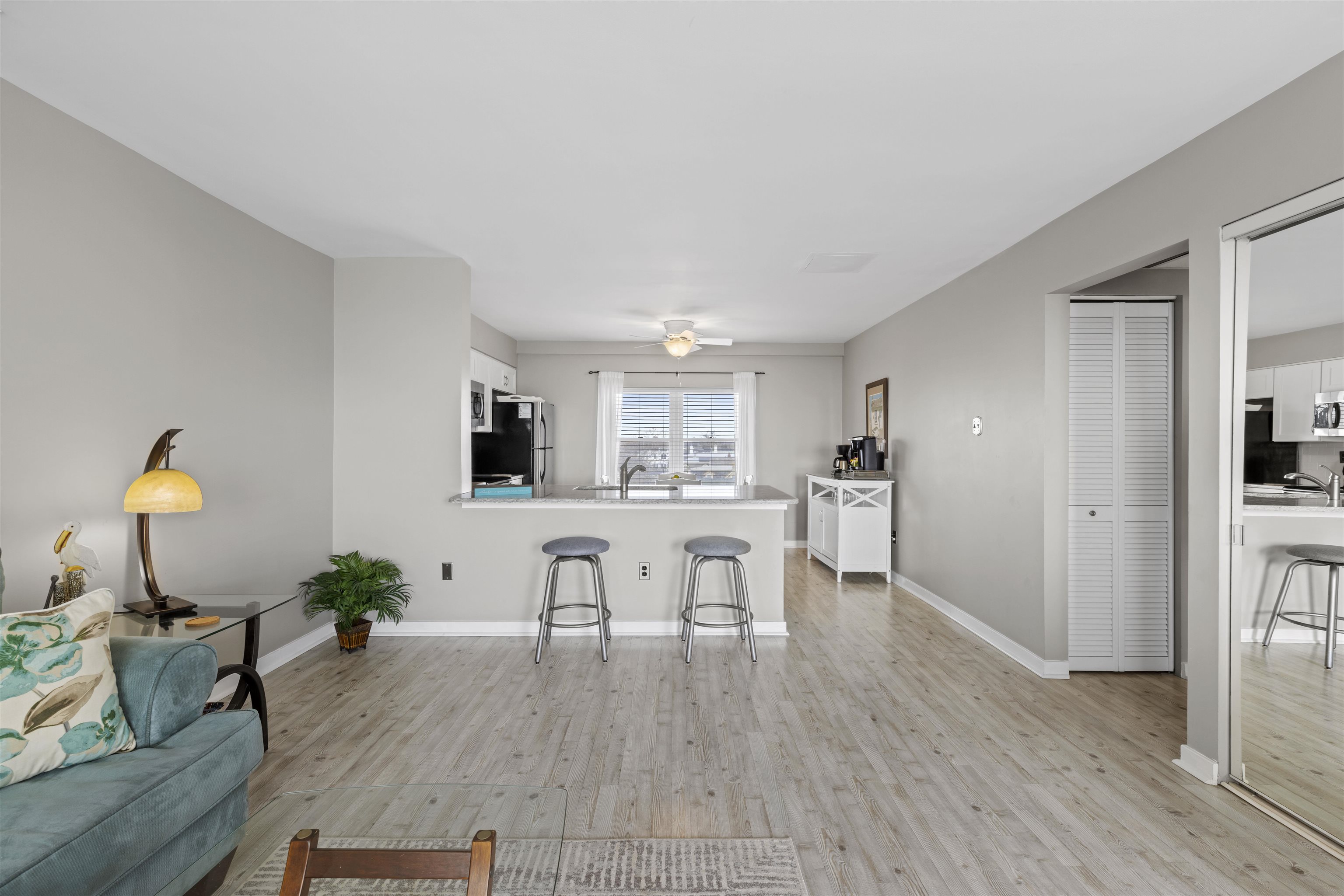9 Jackson Street, Unit 506 Cape May, NJ 08204 - Photo 11 of 29 a living room with furniture dining table and wooden floors