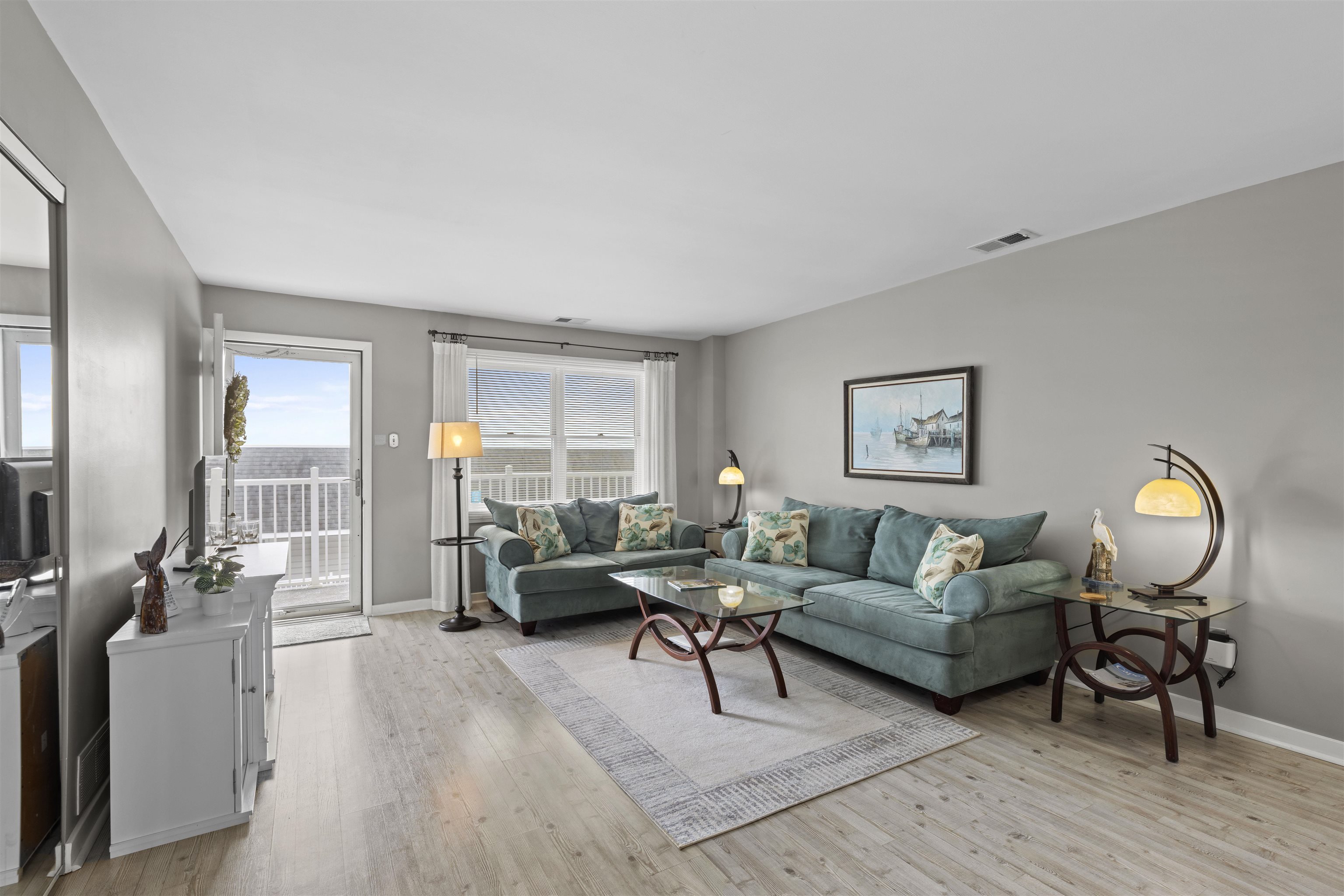 9 Jackson Street, Unit 506 Cape May, NJ 08204 - Photo 12 of 29 a living room with furniture and a wooden floor