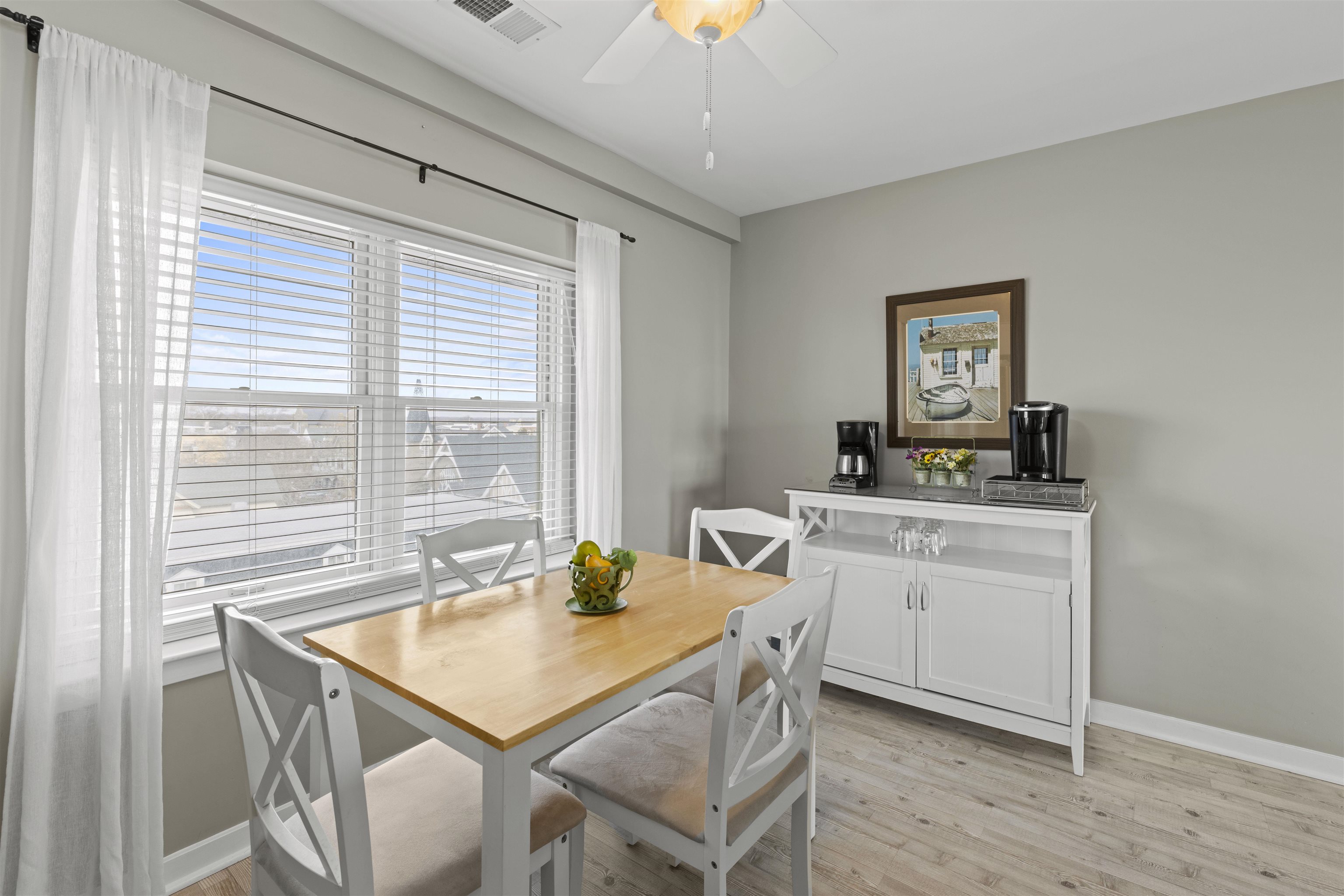9 Jackson Street, Unit 506 Cape May, NJ 08204 - Photo 15 of 29 a view of a dining room with a table and chairs