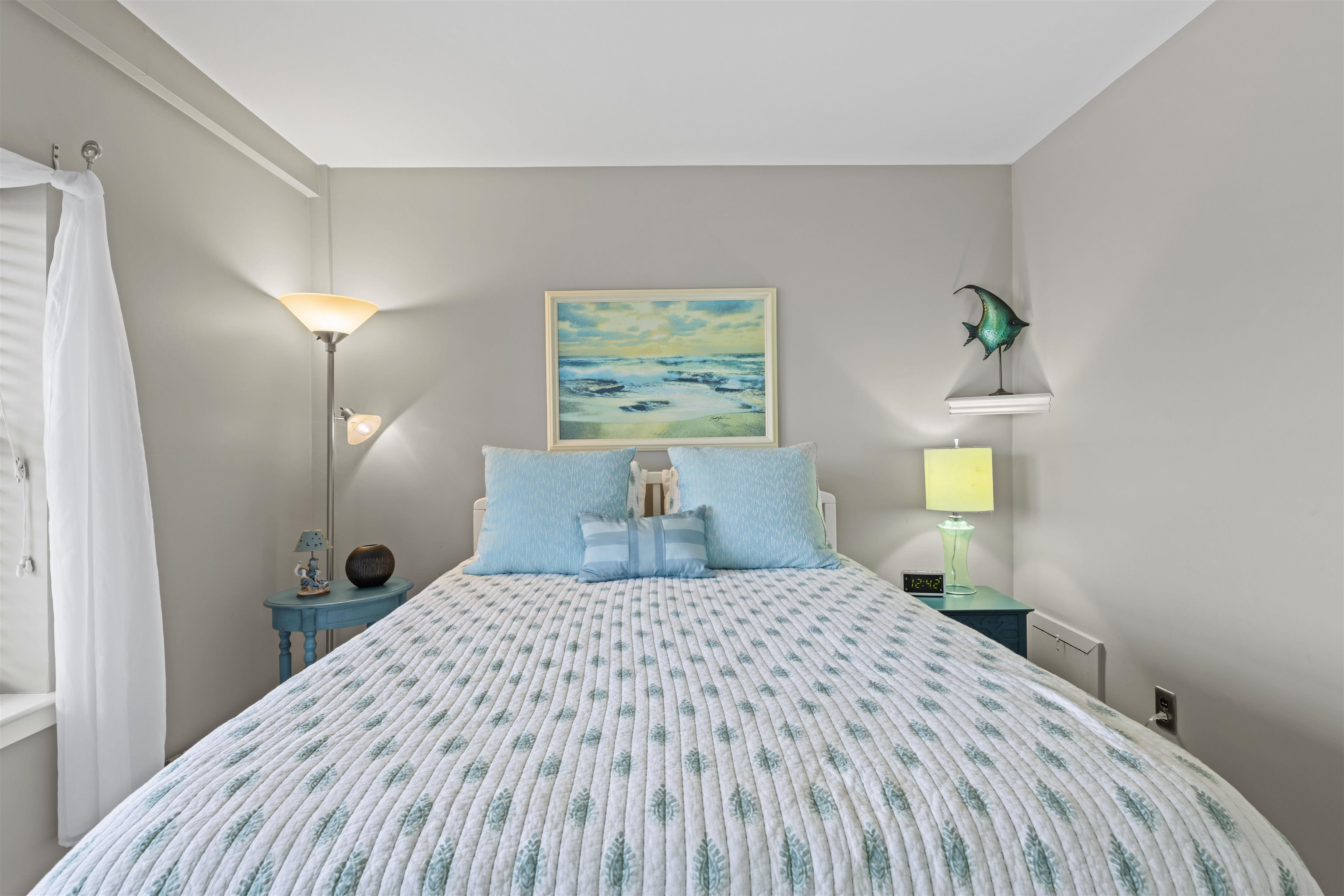 9 Jackson Street, Unit 506 Cape May, NJ 08204 - Photo 16 of 29 a bedroom with a bed and a painting on the wall