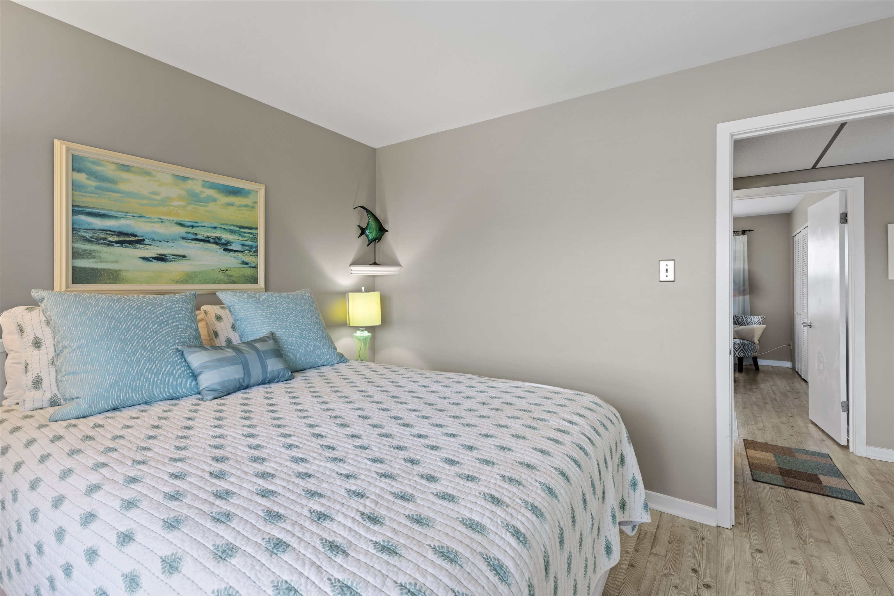 9 Jackson Street, Unit 506 Cape May, NJ 08204 - Photo 18 of 29 a bedroom with a bed and a painting on the wall