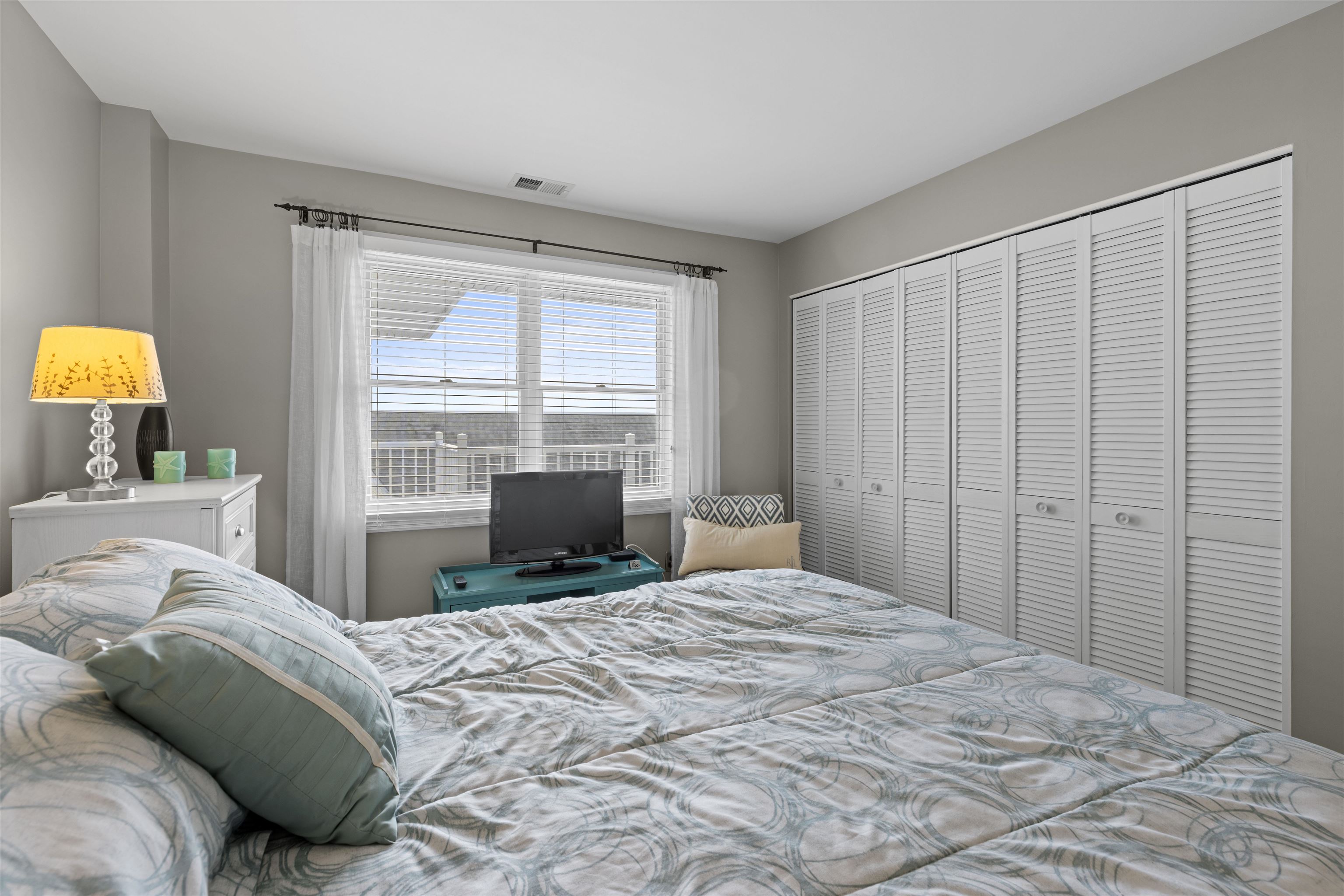 9 Jackson Street, Unit 506 Cape May, NJ 08204 - Photo 21 of 29 a bedroom with a bed and a window