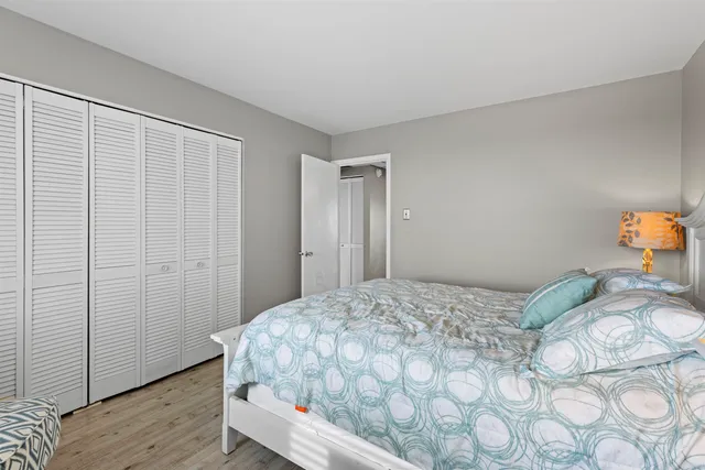 a bedroom with a bed and a closet