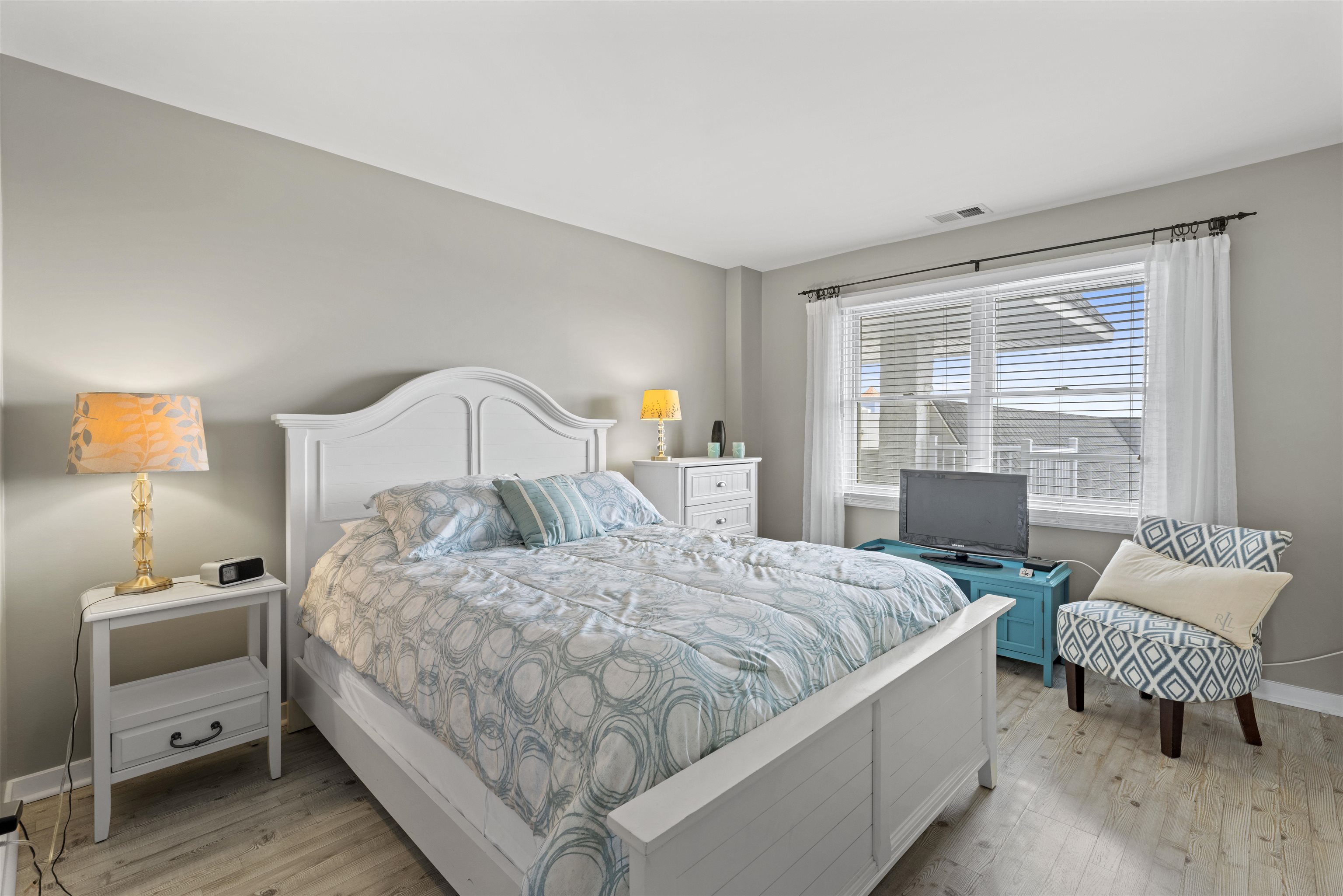 9 Jackson Street, Unit 506 Cape May, NJ 08204 - Photo 24 of 29 a bedroom with a bed and a couch