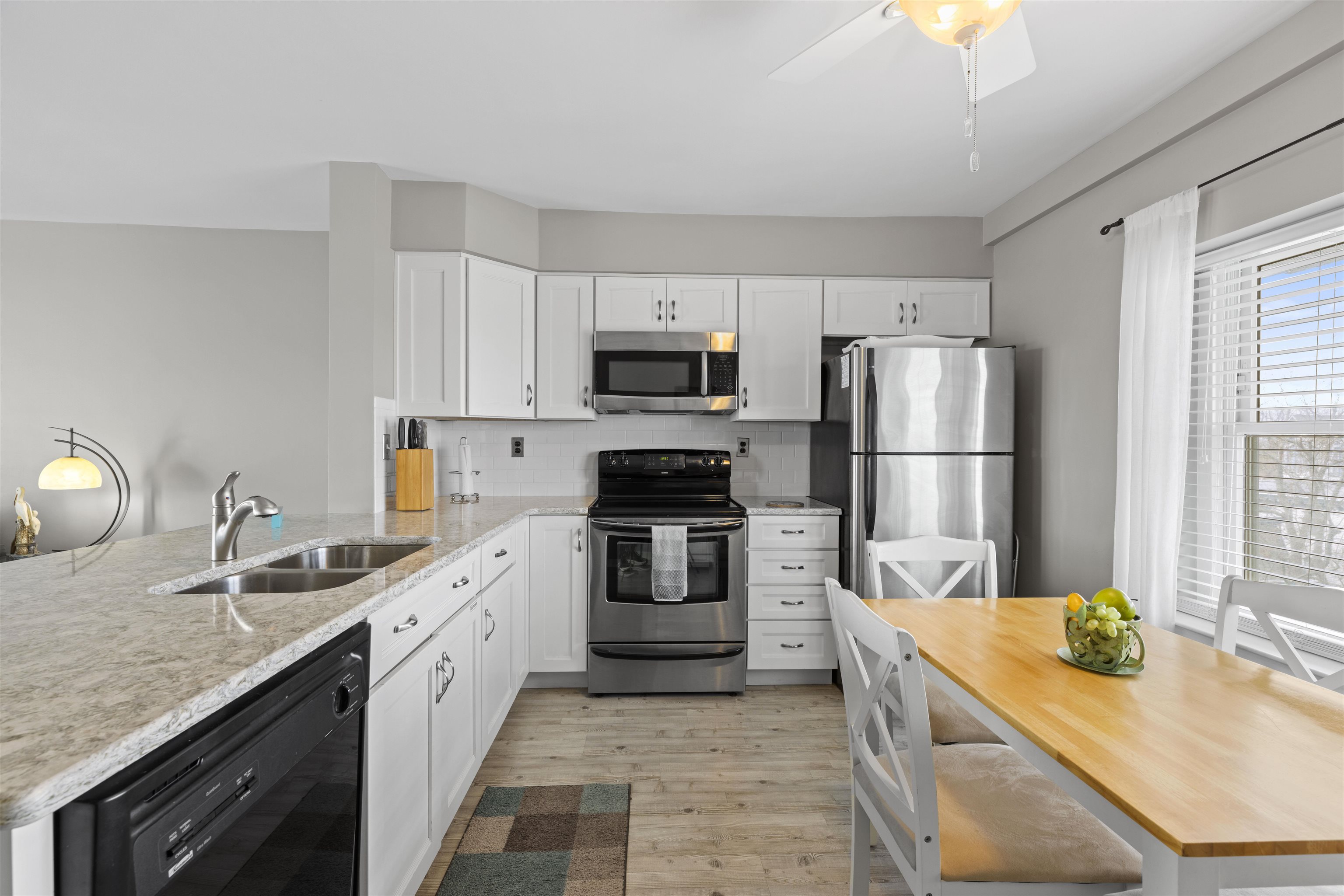9 Jackson Street, Unit 506 Cape May, NJ 08204 - Photo 25 of 29 a kitchen with a sink stove and refrigerator