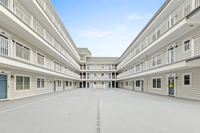 a swimming pool with a car parked in back yard