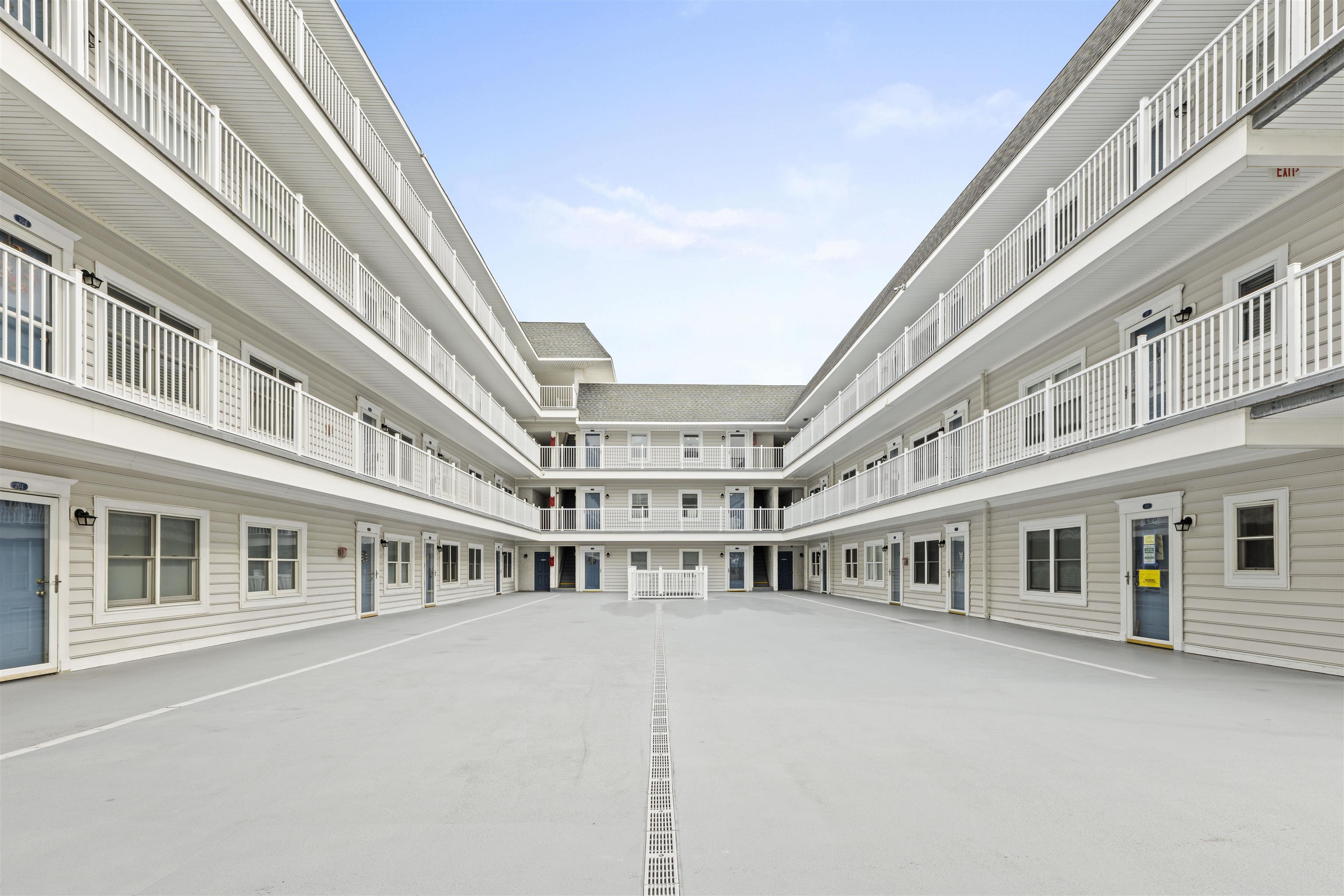 9 Jackson Street, Unit 506 Cape May, NJ 08204 - Photo 26 of 29 view of building with large windows