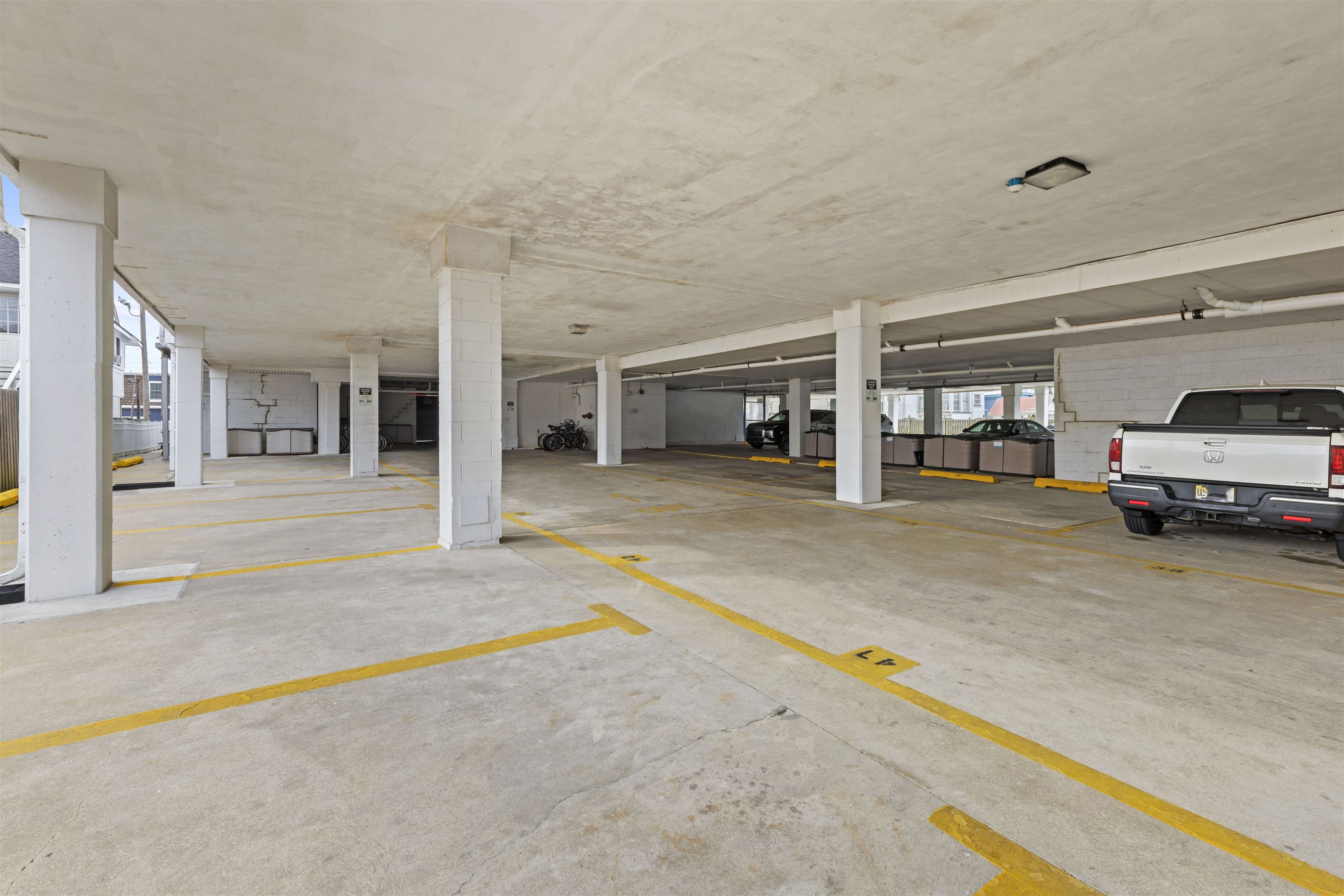 9 Jackson Street, Unit 506 Cape May, NJ 08204 - Photo 27 of 29 a swimming pool with a car parked in back yard