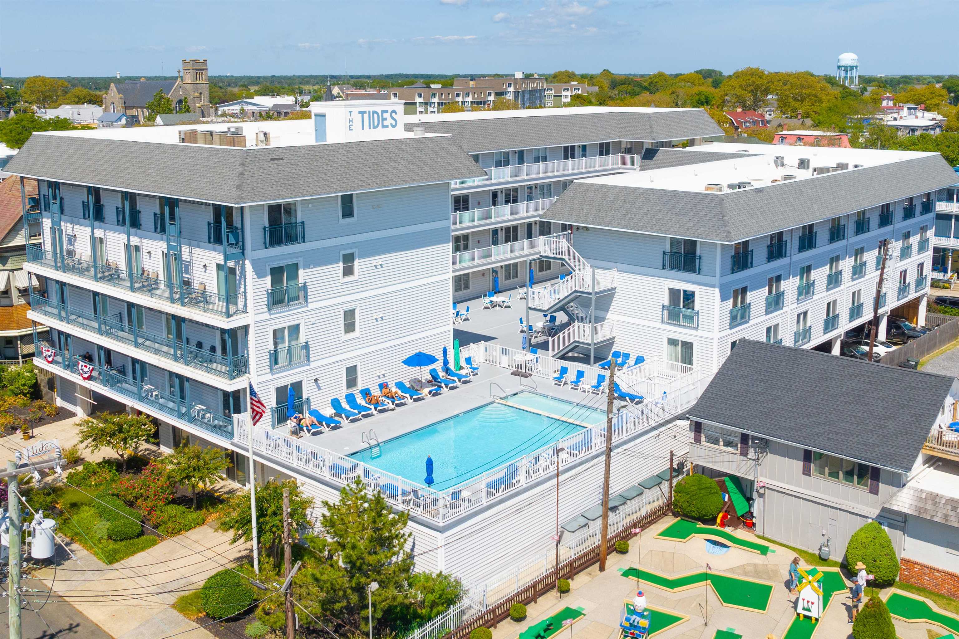 9 Jackson Street, Unit 506 Cape May, NJ 08204 - Photo 4 of 29 a view of a swimming pool with lounge chairs
