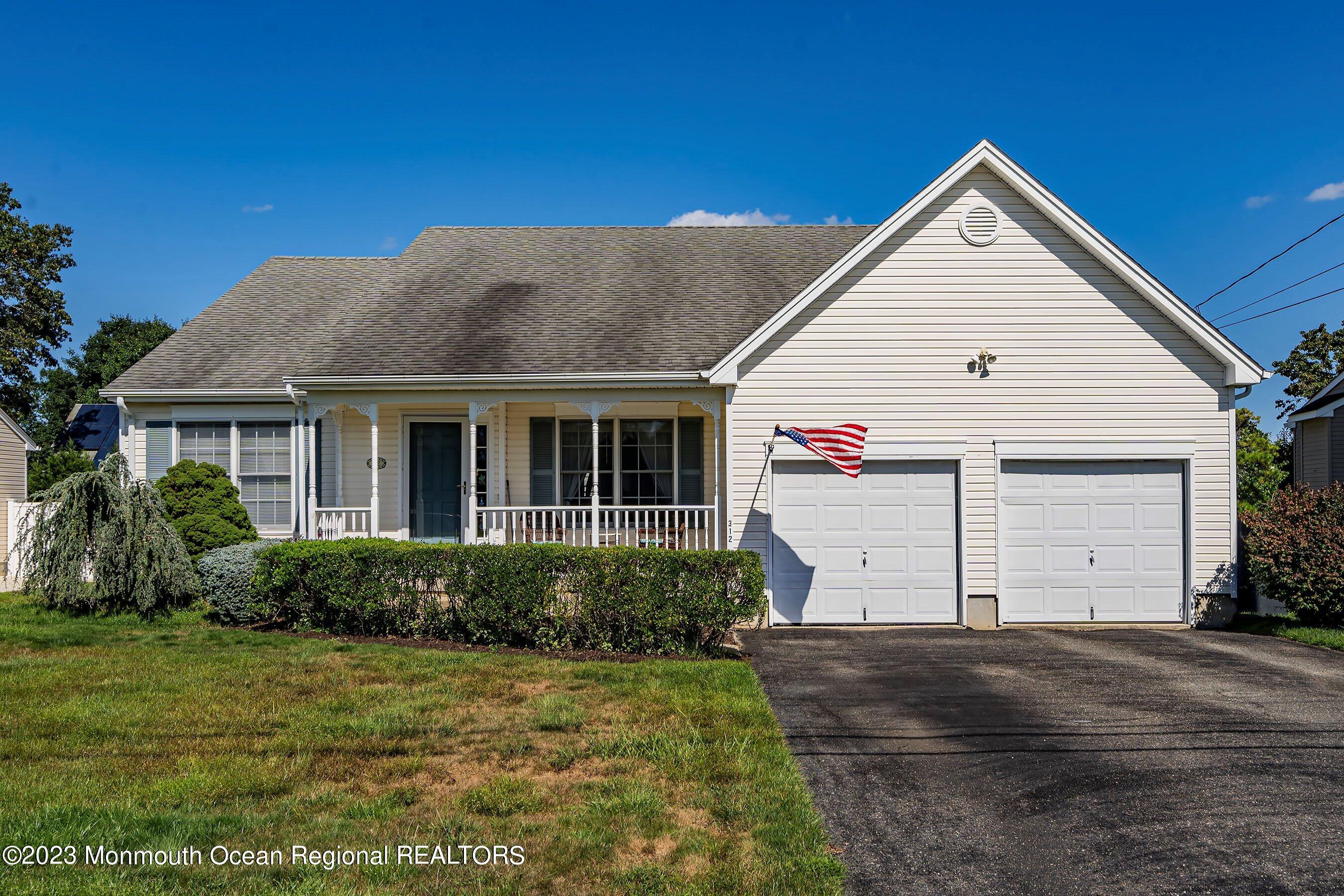 312 Leeward Road Manahawkin, NJ 08050 - Photo 1 of 25 a front view of a house with a yard