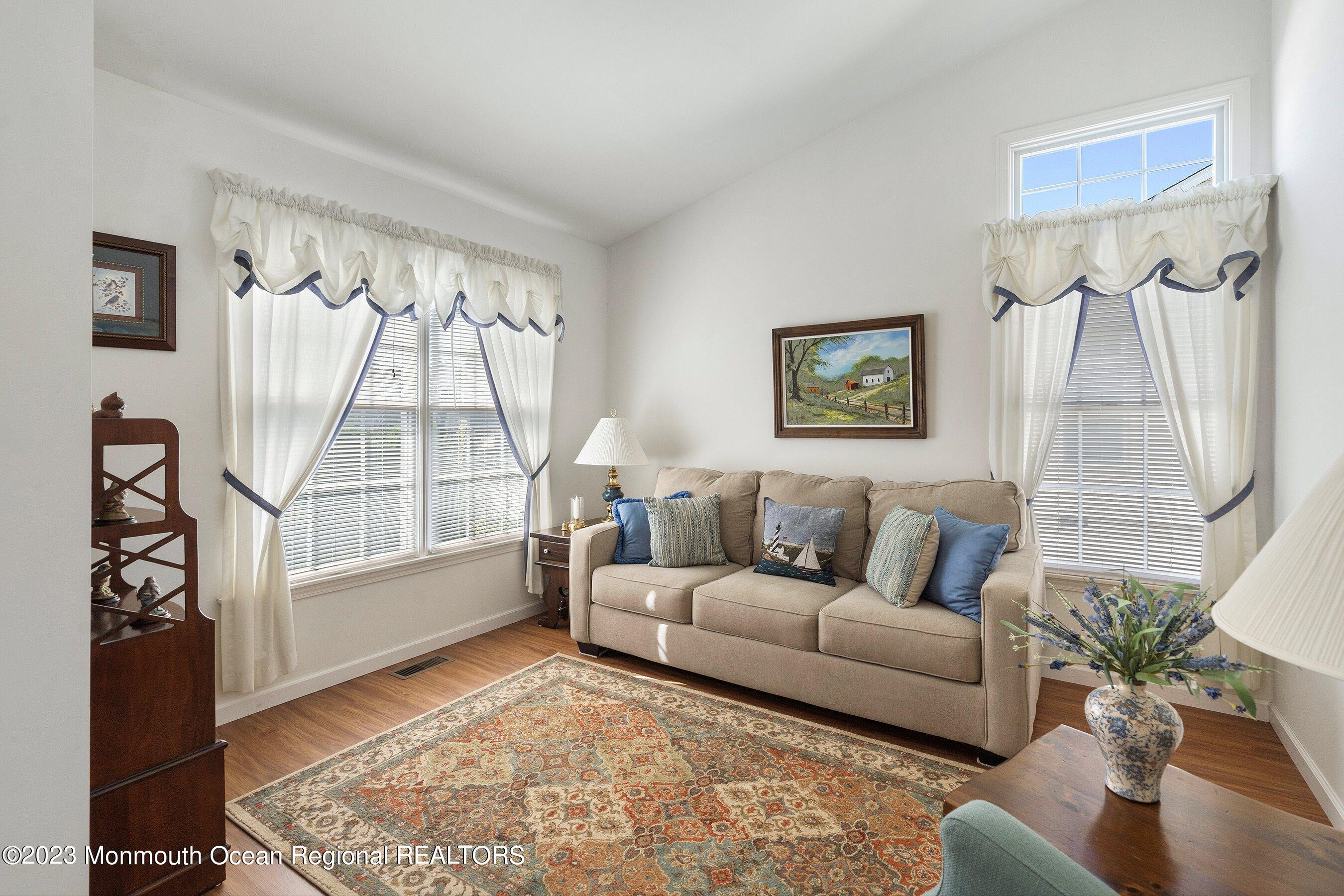 312 Leeward Road Manahawkin, NJ 08050 - Photo 15 of 25 a living room with furniture and a large window