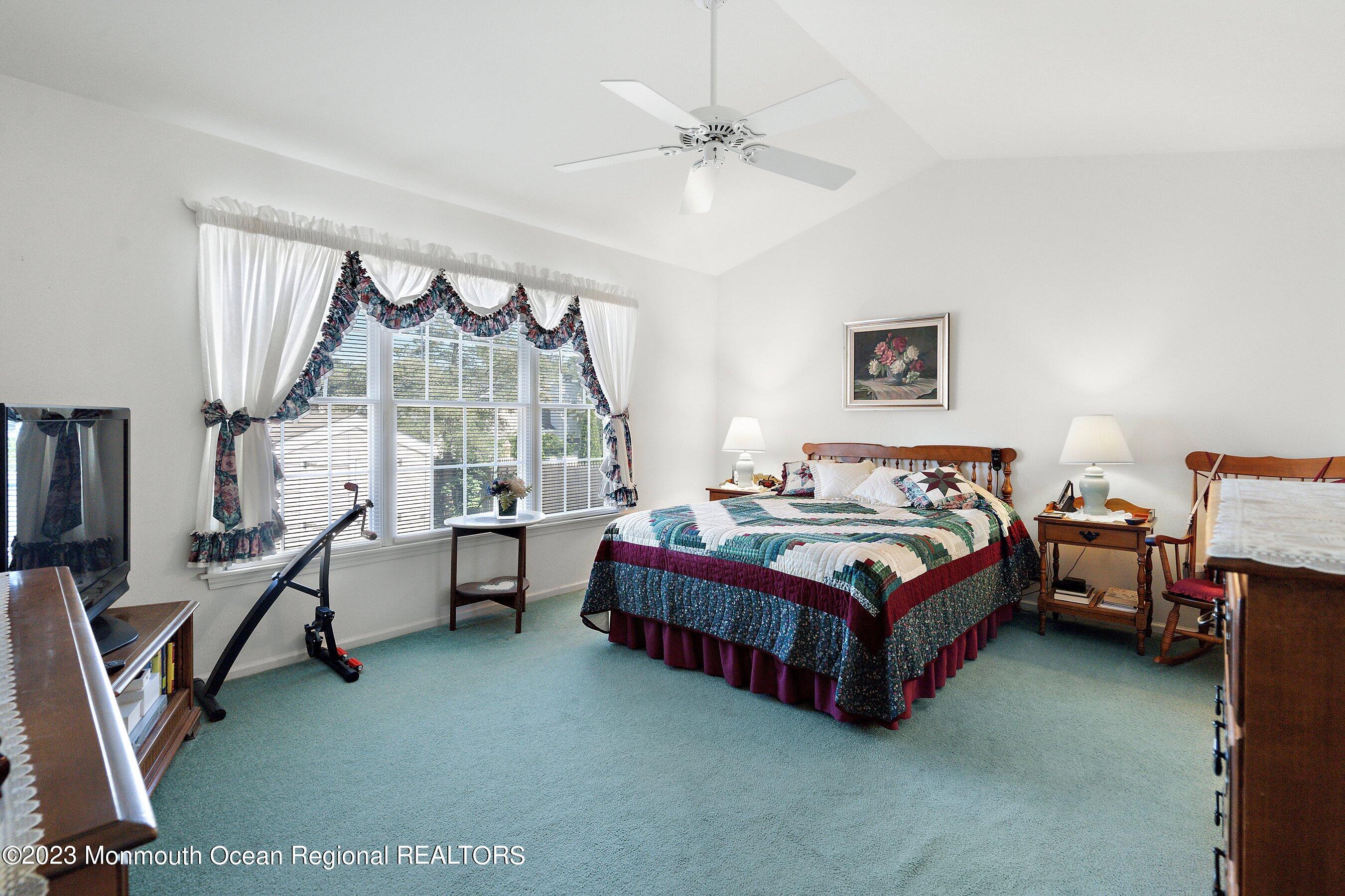 312 Leeward Road Manahawkin, NJ 08050 - Photo 16 of 25 a spacious bedroom with a bed and a table