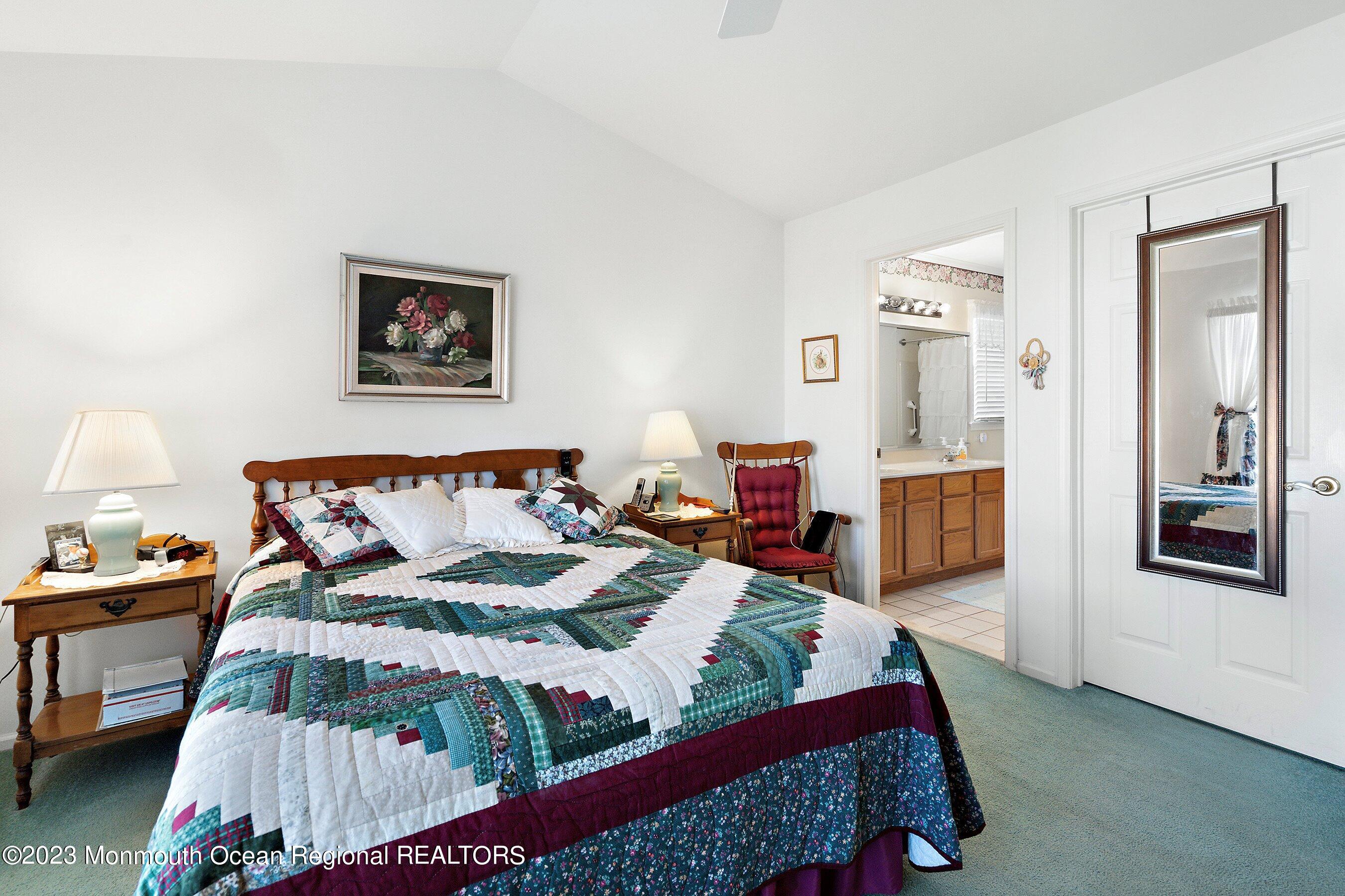 312 Leeward Road Manahawkin, NJ 08050 - Photo 17 of 25 a bedroom with bed and wooden floor