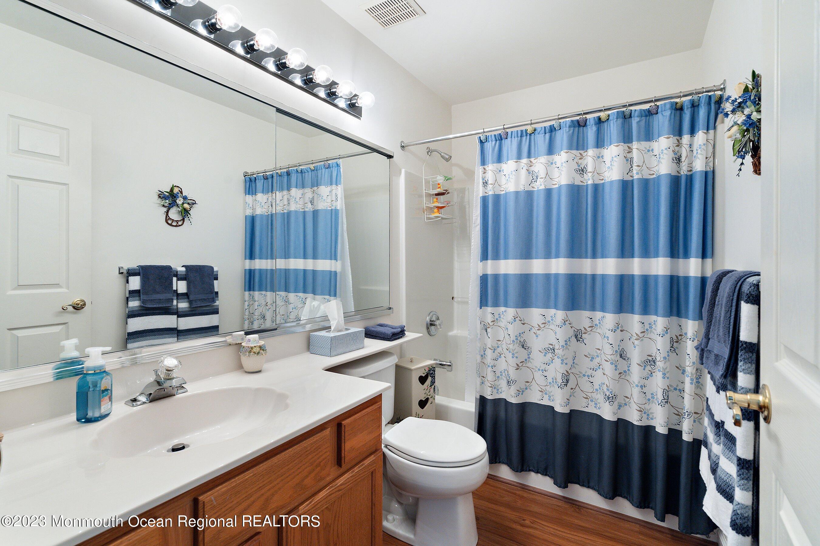 312 Leeward Road Manahawkin, NJ 08050 - Photo 20 of 25 a bathroom with a sink toilet and shower