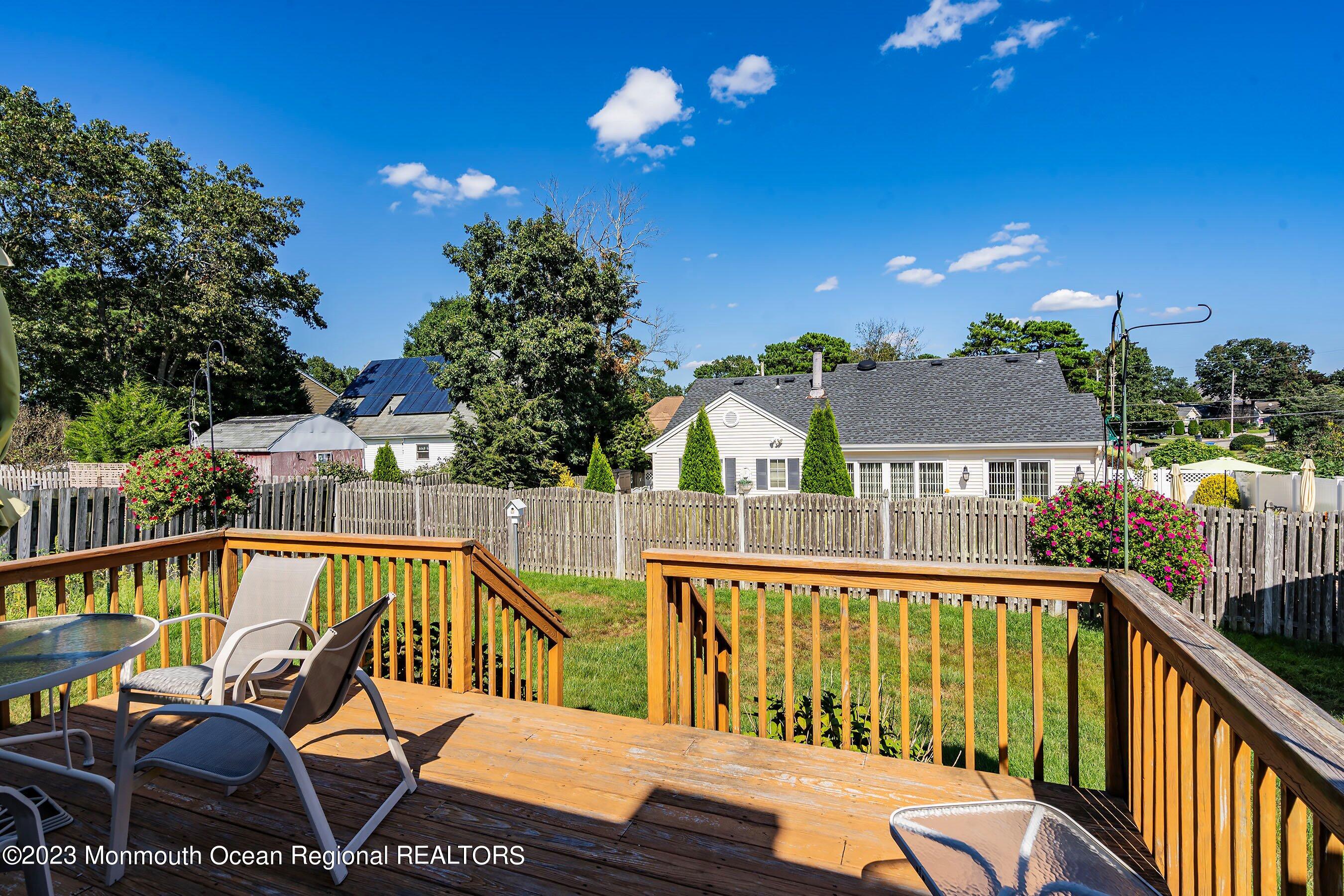 312 Leeward Road Manahawkin, NJ 08050 - Photo 23 of 25 a view of a house with a roof deck