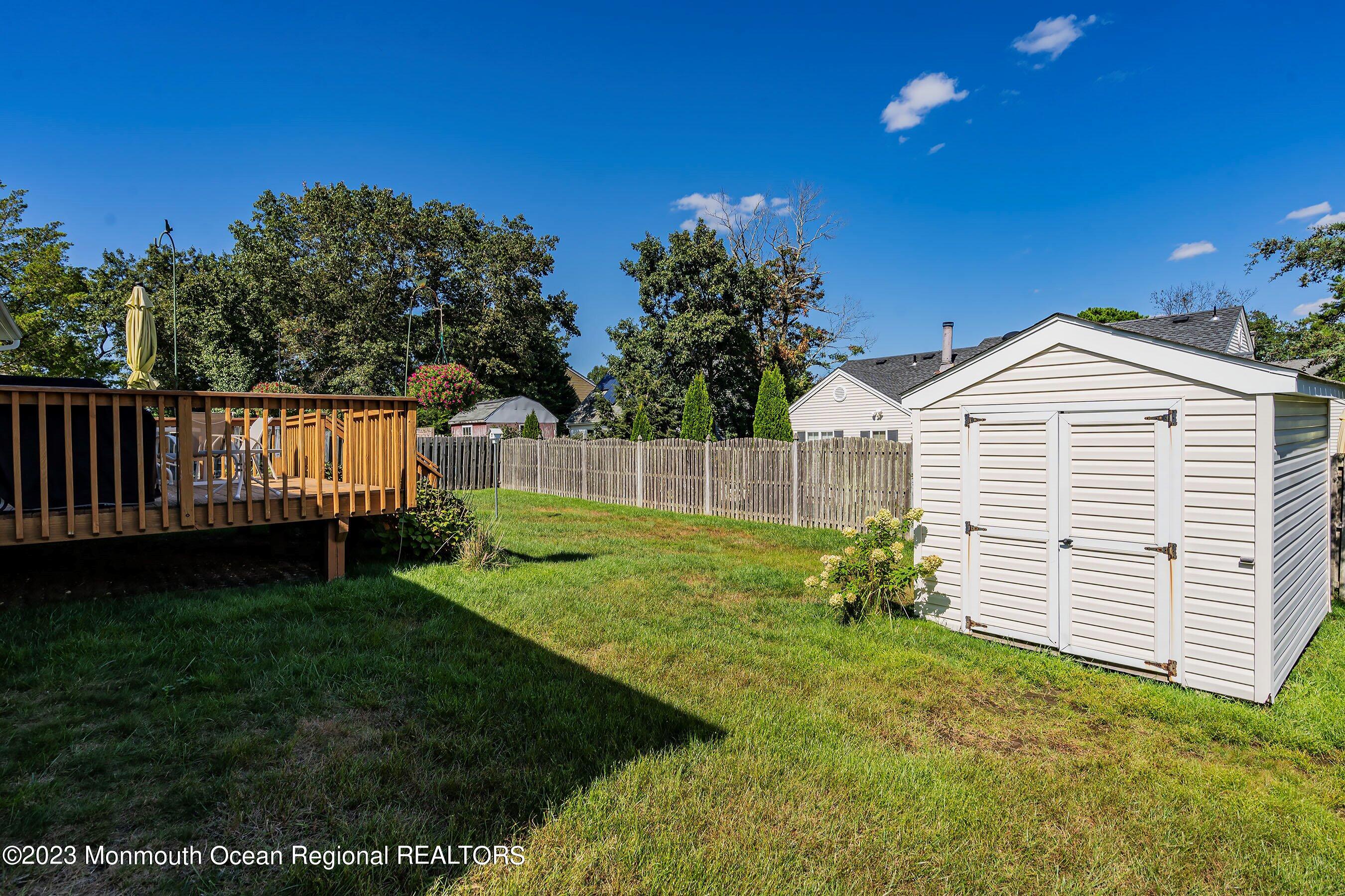 312 Leeward Road Manahawkin, NJ 08050 - Photo 24 of 25 a view of a backyard with a garden
