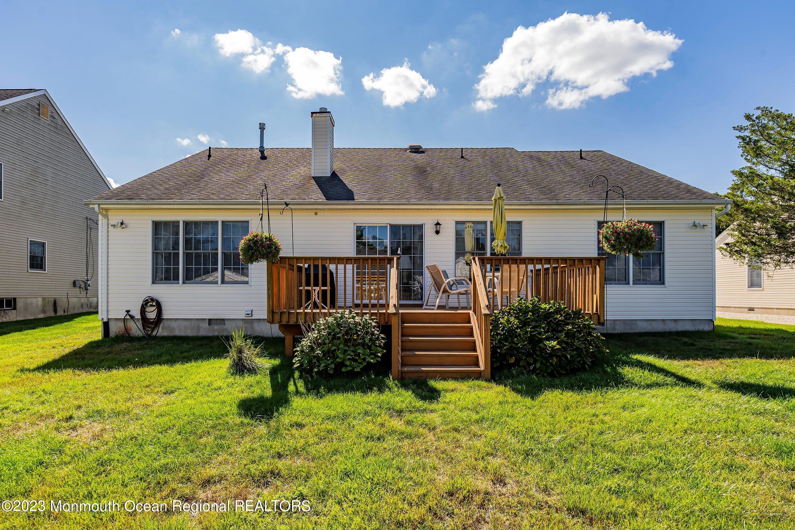 312 Leeward Road Manahawkin, NJ 08050 - Photo 25 of 25 a front view of a house with garden