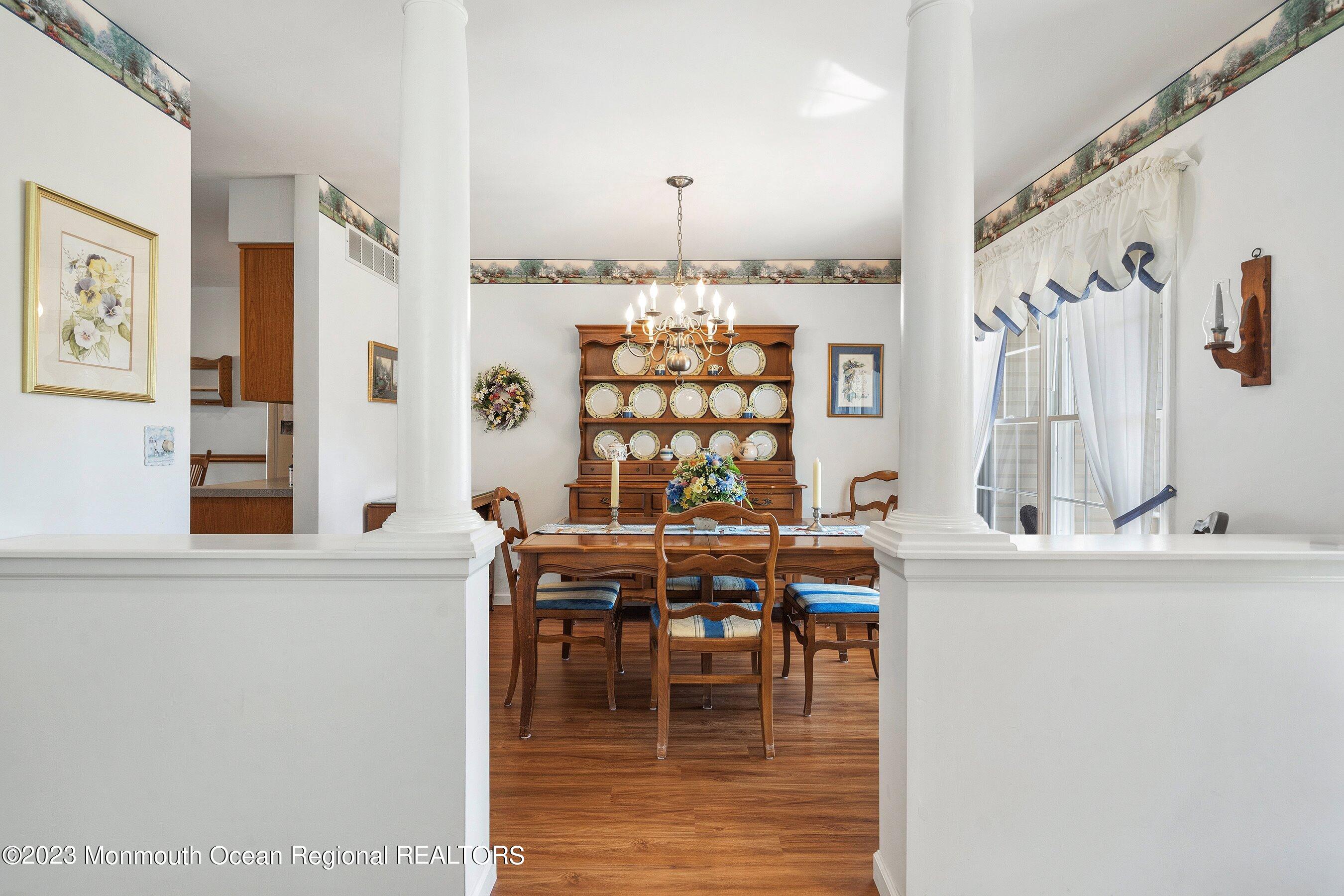 312 Leeward Road Manahawkin, NJ 08050 - Photo 4 of 25 a dining room with furniture and chandelier