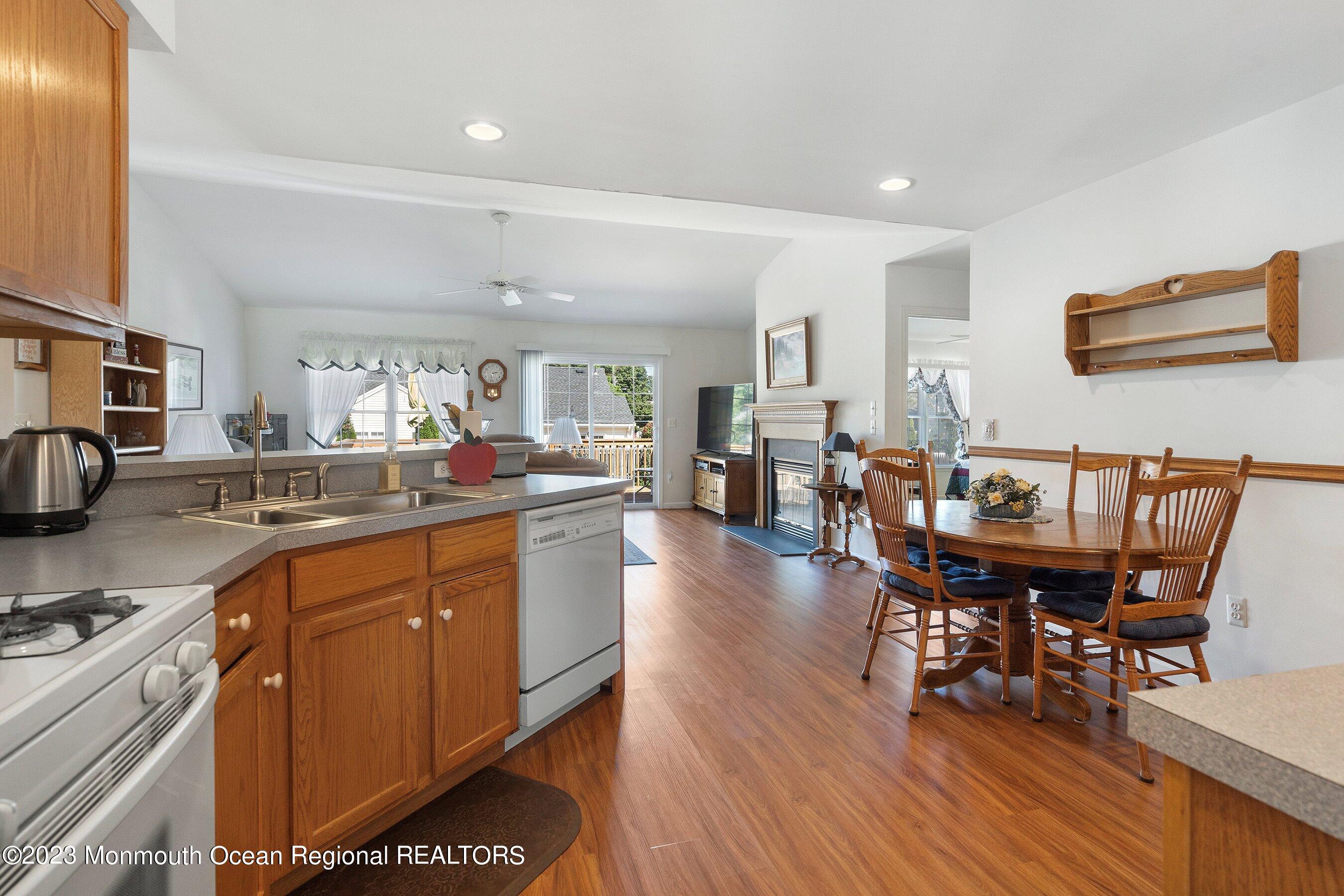 312 Leeward Road Manahawkin, NJ 08050 - Photo 8 of 25 a large kitchen with a table and chairs