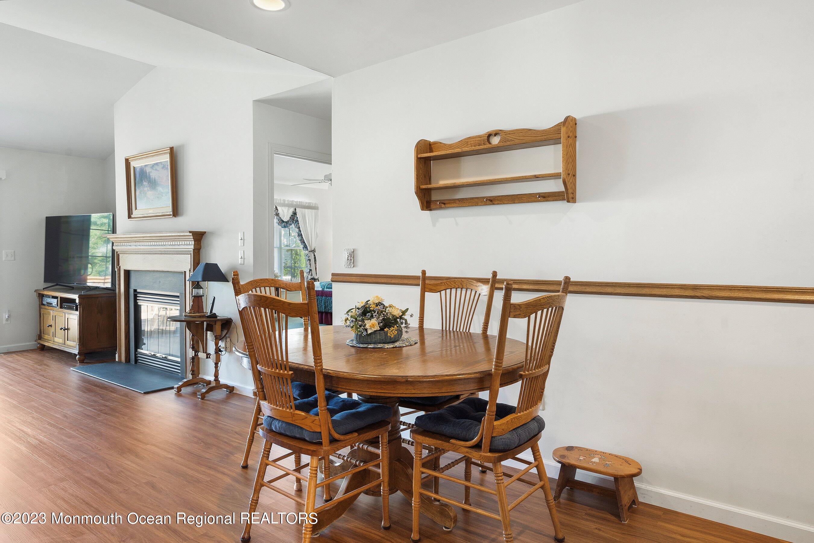 312 Leeward Road Manahawkin, NJ 08050 - Photo 10 of 25 a dining room with furniture and wooden floor