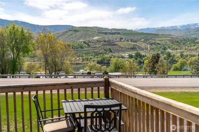 a view of a chairs and table on the balcony